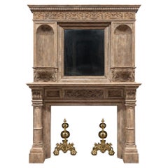 Antique English Victorian period, carved oak fireplace with an integrated mirror