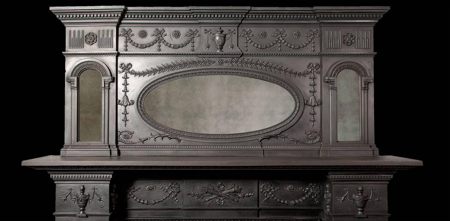 Large antique cast iron fireplace in the Georgian Adam revival style.

Made by the renowned Coalbrookdale Foundry in 1880 to the highest of standards, this black polished metal fireplace features exceptionally fine castings.

The twin fluted