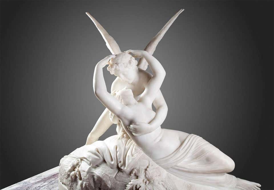 Psyche revived by Cupid’s kiss. After Canova. Beautifully carved in fine statuary marble.
The winged young man who has just landed on a rock where a girl lies unconscious, is the god Eros – Cupid in Latin and can be recognized by his wings. The