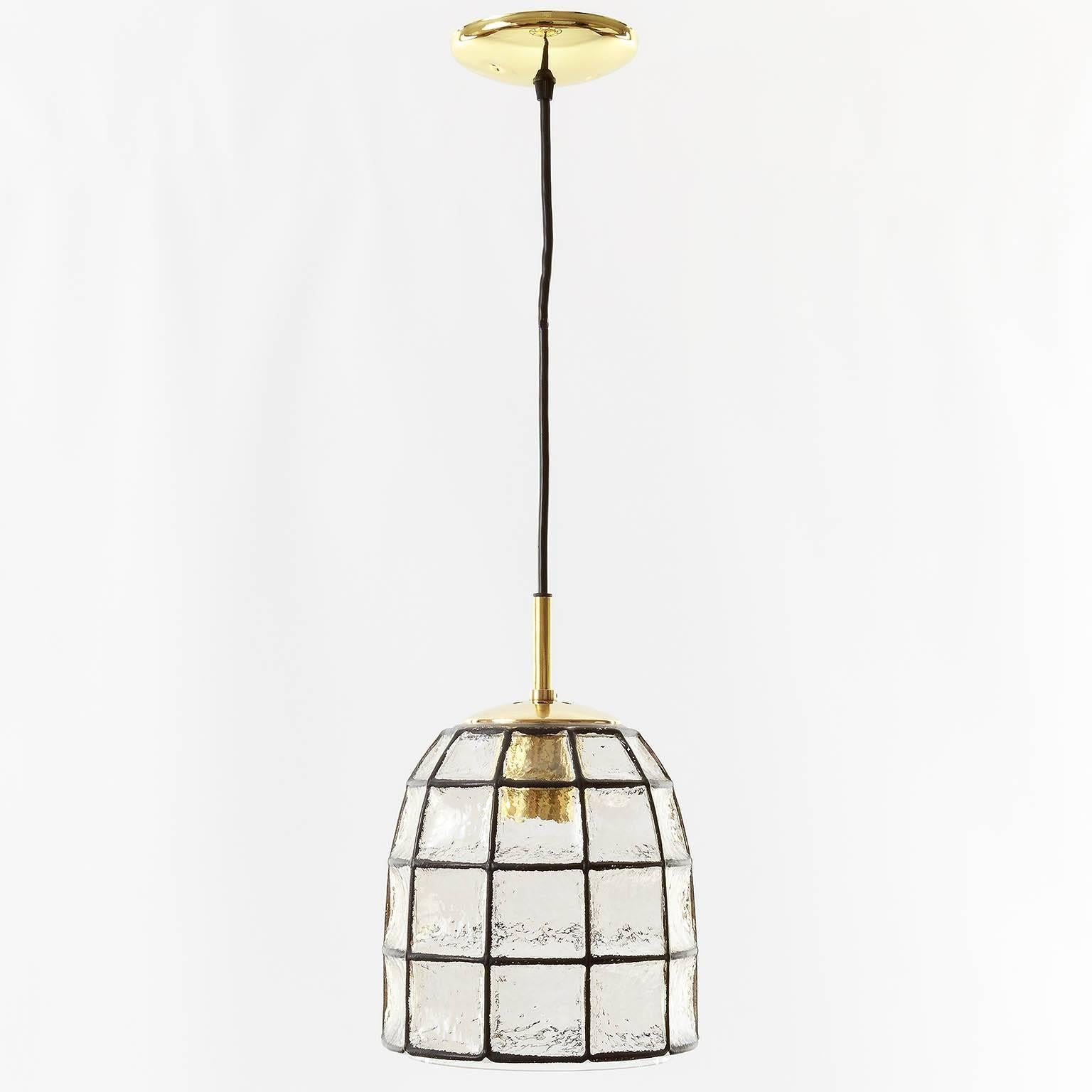 Beautiful and unique design 'iron' and glass pendant light by Glashütte Limburg, Germany. Black 'iron' squares inlaid in thick clear glass. The hardware is made of polished brass. Newly rewired. One medium base bulb (100W max.). A cord in any length