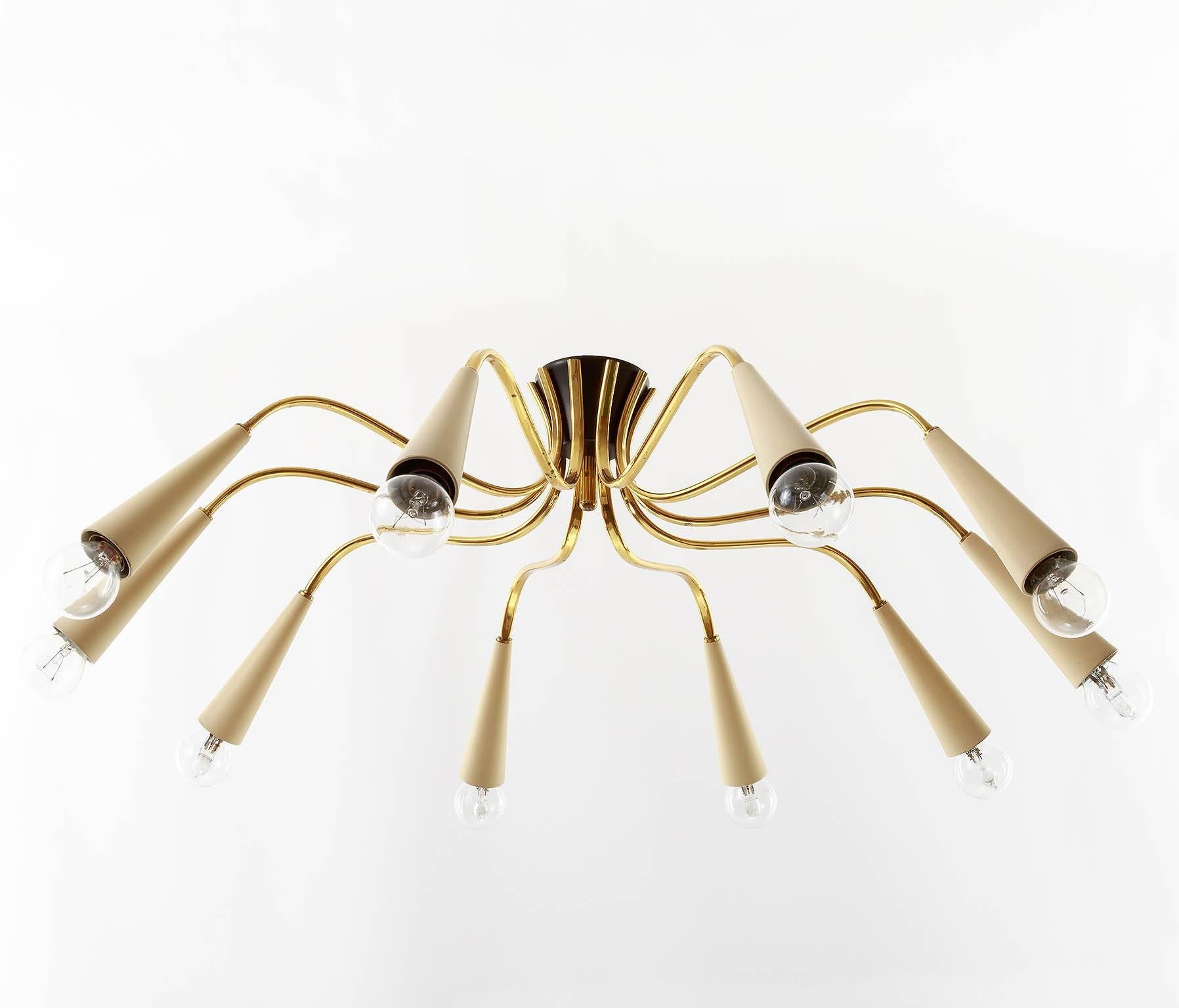 Italian ten-arm brass spider light fixture from the 1960s. Ten small base bulbs.
