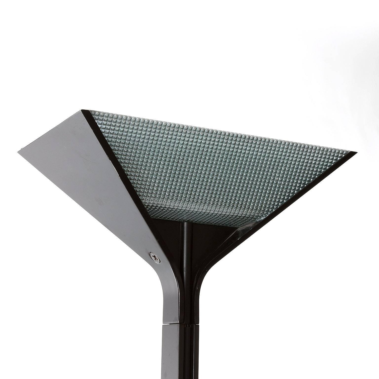 Italian floor uplighter designed by Tobia Scarpa for Flos in 1977, manufactured between 1983-1984. Made of die-cast aluminium, plastic and glass. Stamped on base ´Flos , Papillona, Made in Italy´. 
Tobia Scarpa is the son of world renowned