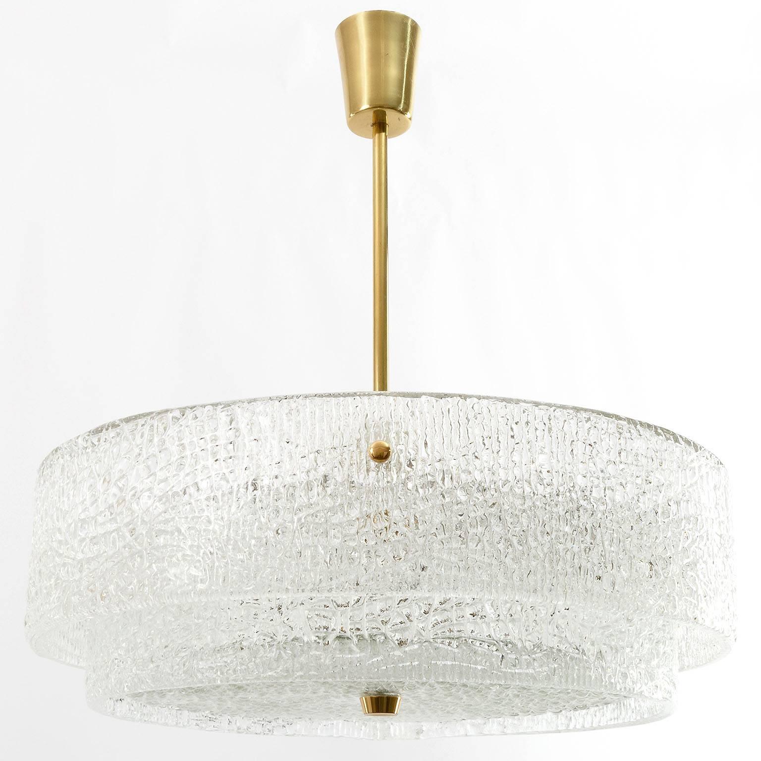 A beautiful textured glass and brass light fixture by J.T. Kalmar, Vienna, manufactured the 1950s. Thick textured glass creates a fantastic light effect. Six medium Edison base bulbs.
The stem and total drop can be customized to any size for free.