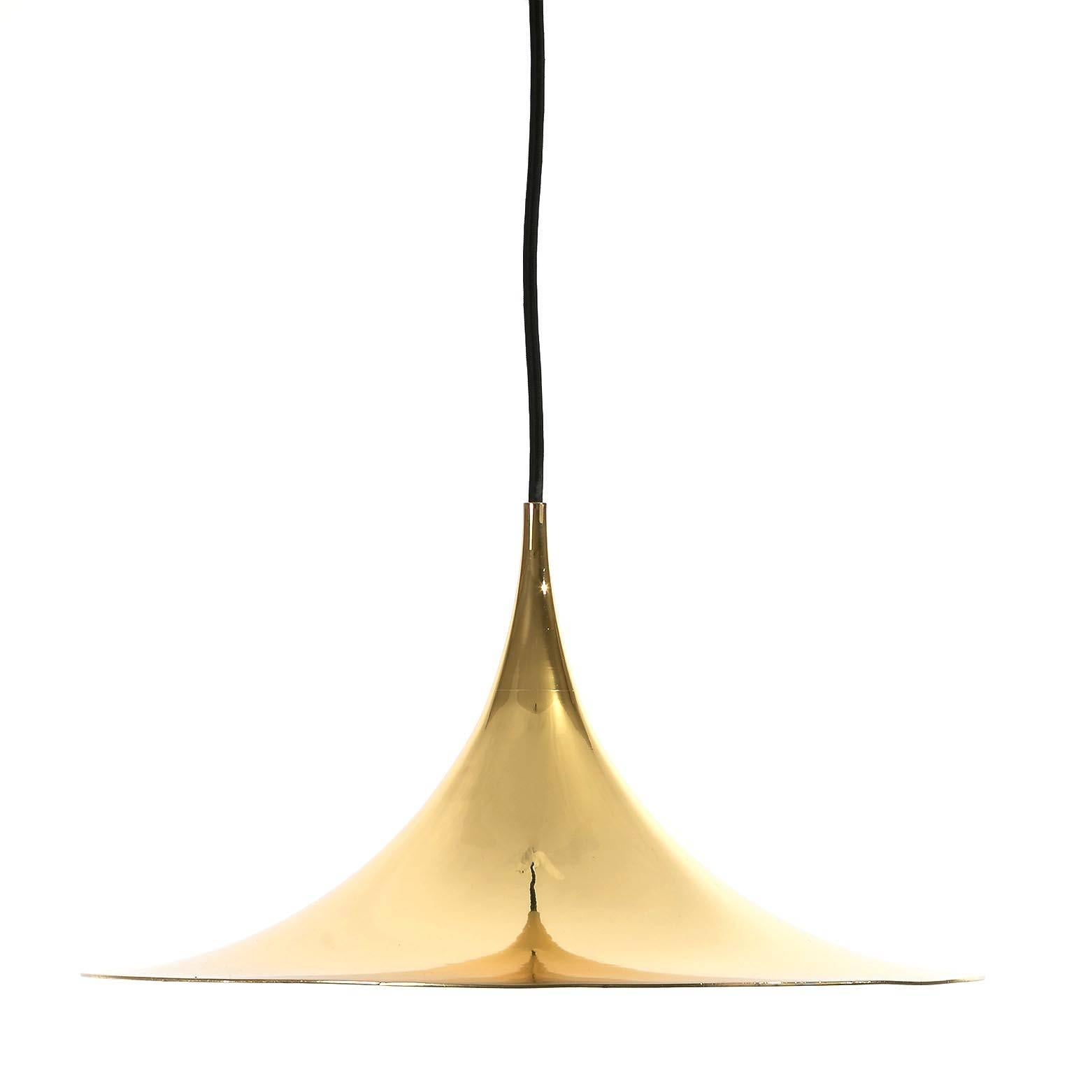 Set of three brass-plated hanging lamps by Bonderup and Thorup for Fog & Mørup, Denmark, manufactured in Mid-Century, circa 1968. 
Newly rewired. One medium Edison base bulb (100W max).
Excellent condition, restored: Newly brass-replated outside,