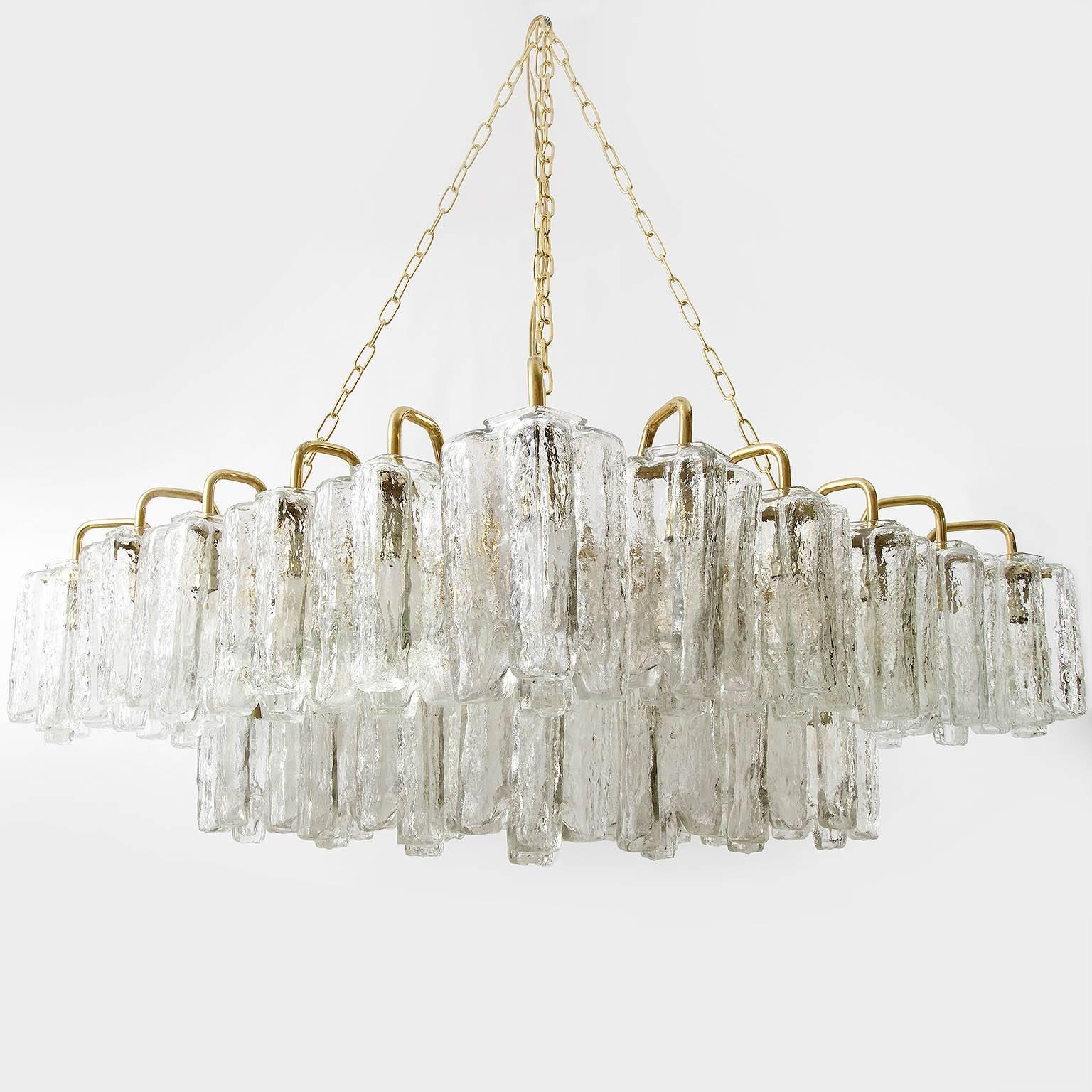 Two (a pair of) square and large light fixtures by J.T. Kalmar, Austria, manufactured in Mid-Century, ca. 1970 (end of 1960s and beginning of 1970s). 
They can be used as pendant lights / chandeliers or as flush mount lights because they can be hung