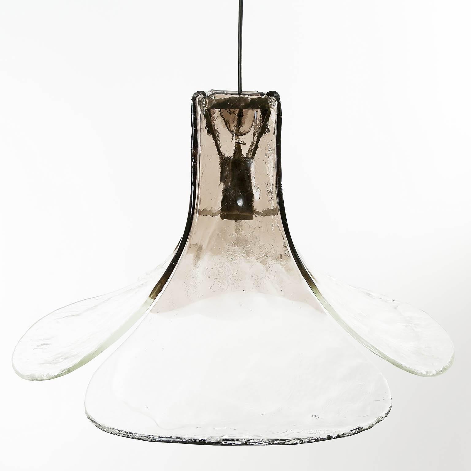 A wonderful Italian pendant light fxiture with four large hand blown clear and smoked Murano glass petals which are supported by a metal frame designed by Carlo Nason for Mazzega, Italy, manufactured in Mid-Century in 1970s.

Body of fixture: 16