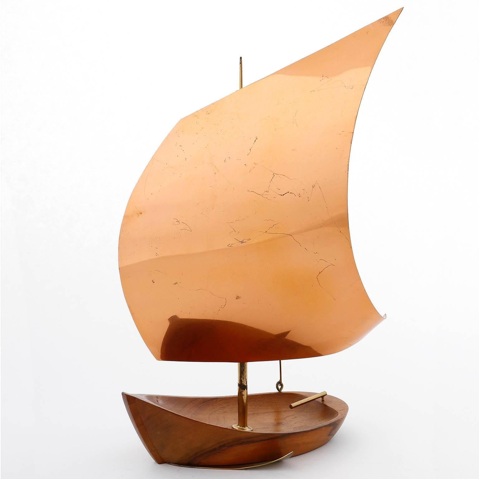 A sailing boat made of wood, copper and brass by Franz Hagenauer, Austria, Vienna, 1950.
It is stamped at the underside with 