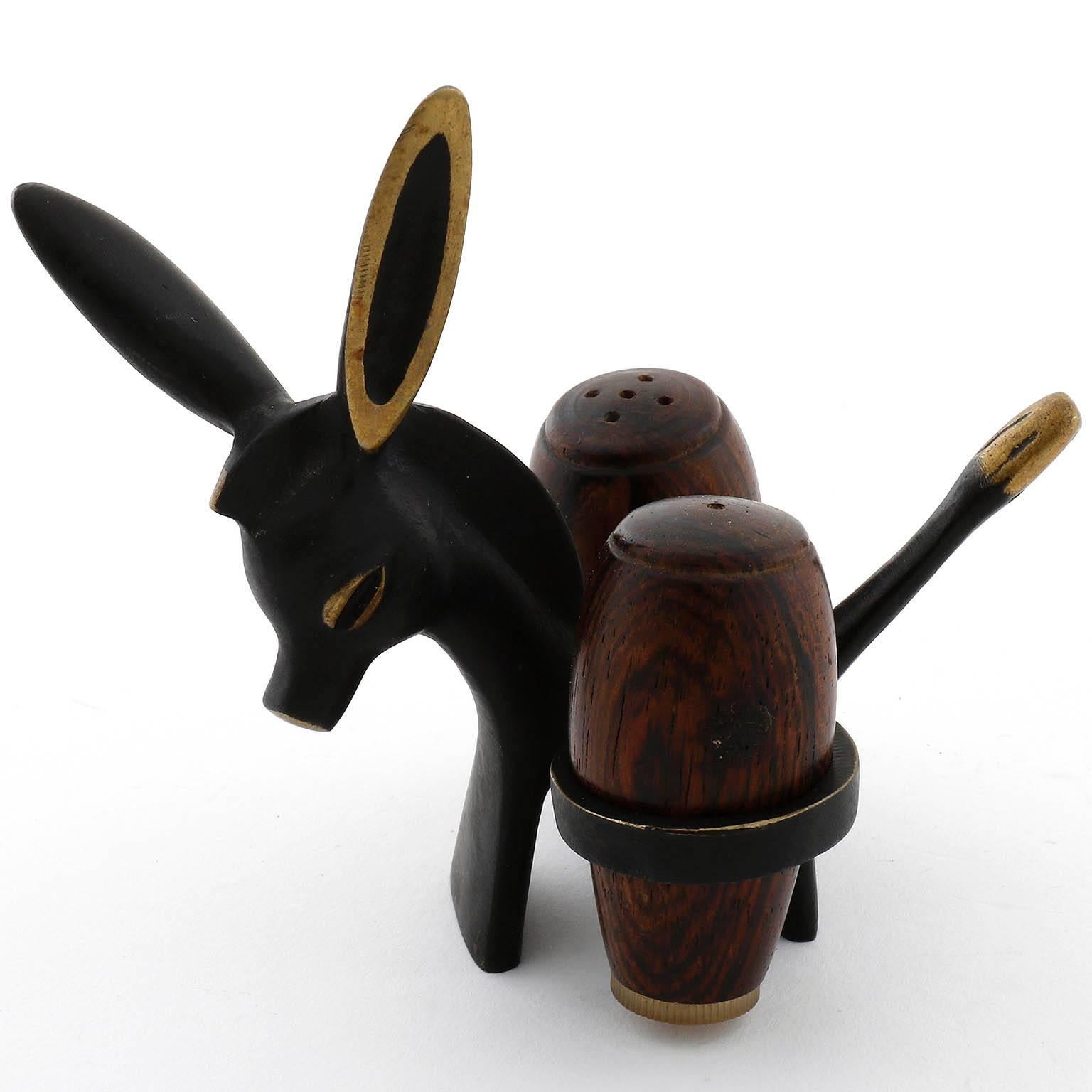 A Walter Bosse salt and pepper donkey set by Hertha Baller, Austria, Vienna, circa 1950.
The donkey is made of blackened and polished brass. The shakers are made of palisander wood.
labeled on the underside.