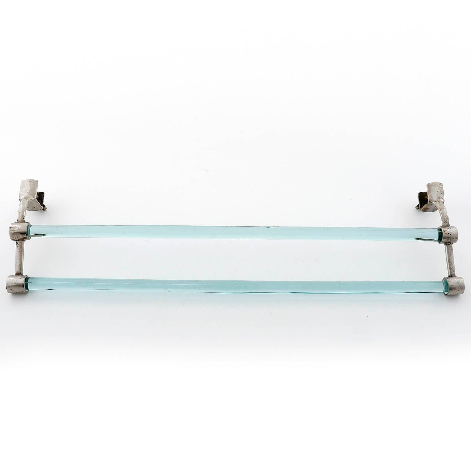 An Art Deco towel holder with two bars made of nickel plated brass and glass rods, manufactured circa 1930.
There are two screws to mount the item on a board or table. Nice patina on nickel.