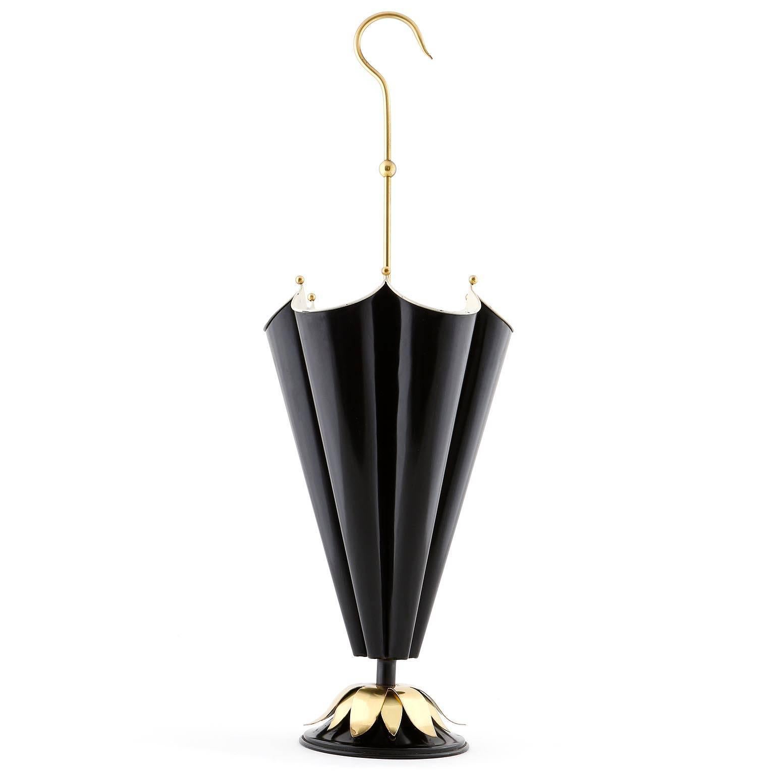 An Italian vintage umbrella stand, manufactured in Mid-Century, circa 1950. 
It is made of white and black enameled metal and polished brass. Nice patina on brass.