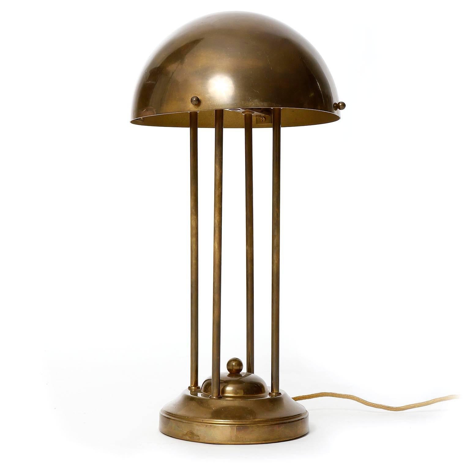 A table or desk lamp in the design of Josef Hoffmann, Austria. 
Josef Hoffmann designed those lights for the house of Dr. Henneberg in the area "Hohe Warte" in Vienna in 1900.
This light was manufactured in 1970s or later.