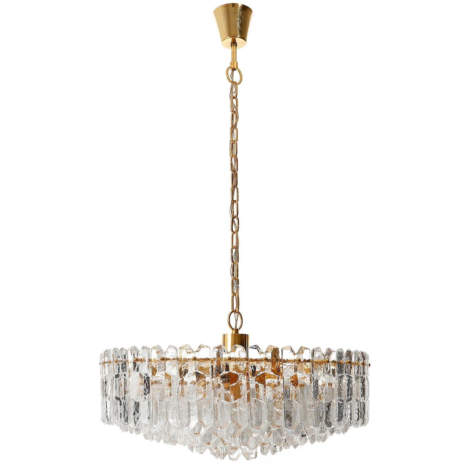 One of two grand and very exquisit 24-carat gold-plated brass and clear brillant glass 'Palazzo' light fixture by J.T. Kalmar, Vienna, Austria, manufactured in circa 1970 (late 1960s and early 1970s). 
Labeled and documented in the Kalmar catalogues