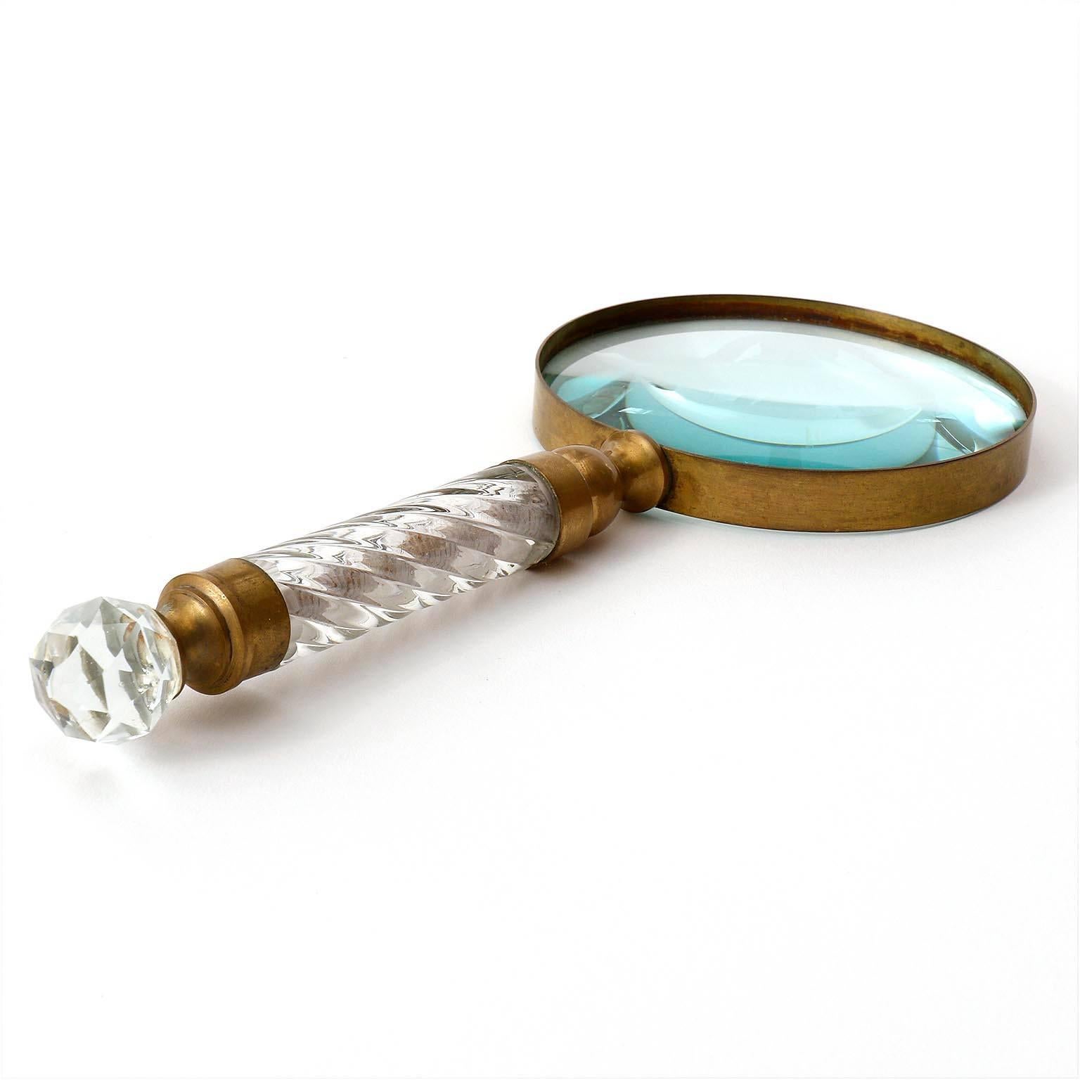 A magnifying glass made of brass and crystal glass.
Very nice patina on brass.
