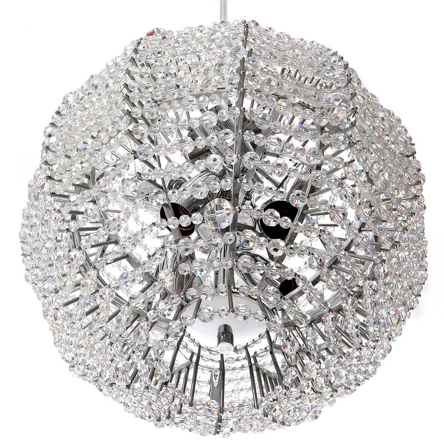 A rare and fantastic Supernova Sputnik chandelier by Bakalowits & Soehne, Austria, Vienna, manufactured in Mid-Century, circa 1960.
A ball shaped nickel-plated brass frame is decorated with hundreds of hand-cut crystal glasses.
The light takes eight