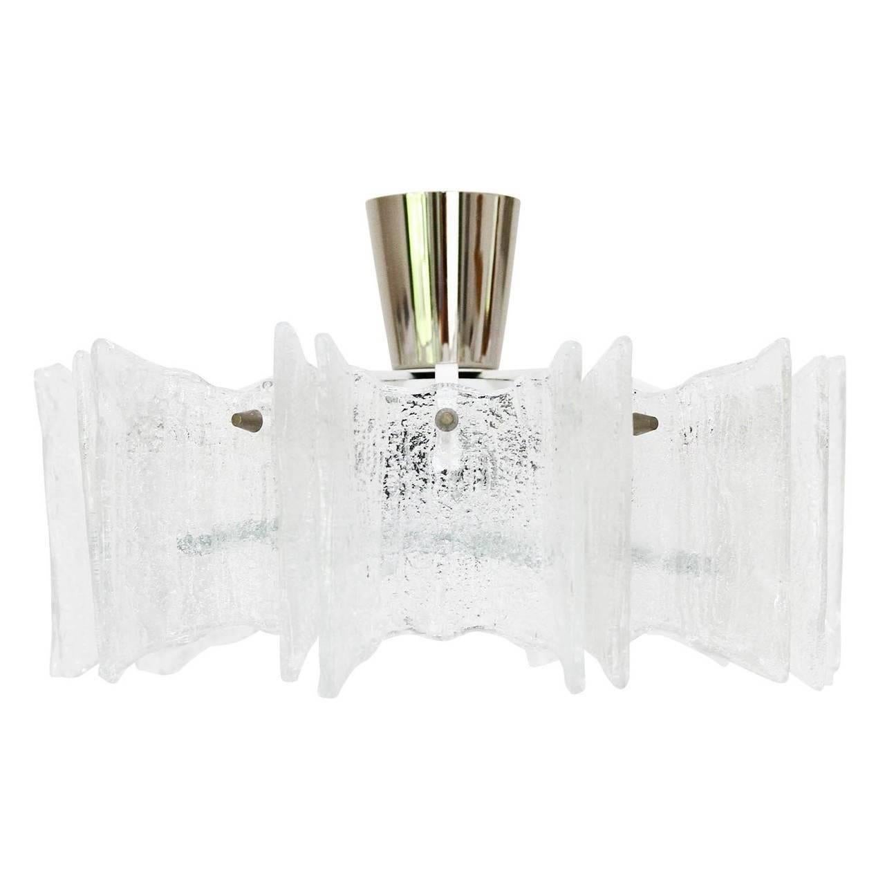 A beautiful star-shaped light fixture by Kalmar Vienna, Austria, manufactured in Mid-Century in 1960s.
It is made of frosted glass and a white lacquered and nickel-plated (chrome) frame. The light can be used as flush mount light or as chandelier.