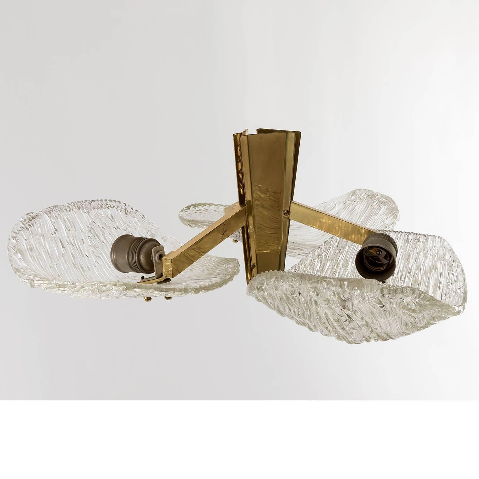 A beautiful ceiling light fixture model 'Trivon' no. 5209 by J.T. Kalmar, Austria, manufactured in Mid-Century, circa 1960 (late 1950s-early 1960s). 
It made of brass and pressed textured glass with nice patina on brass. 
Each lamp has three sockets