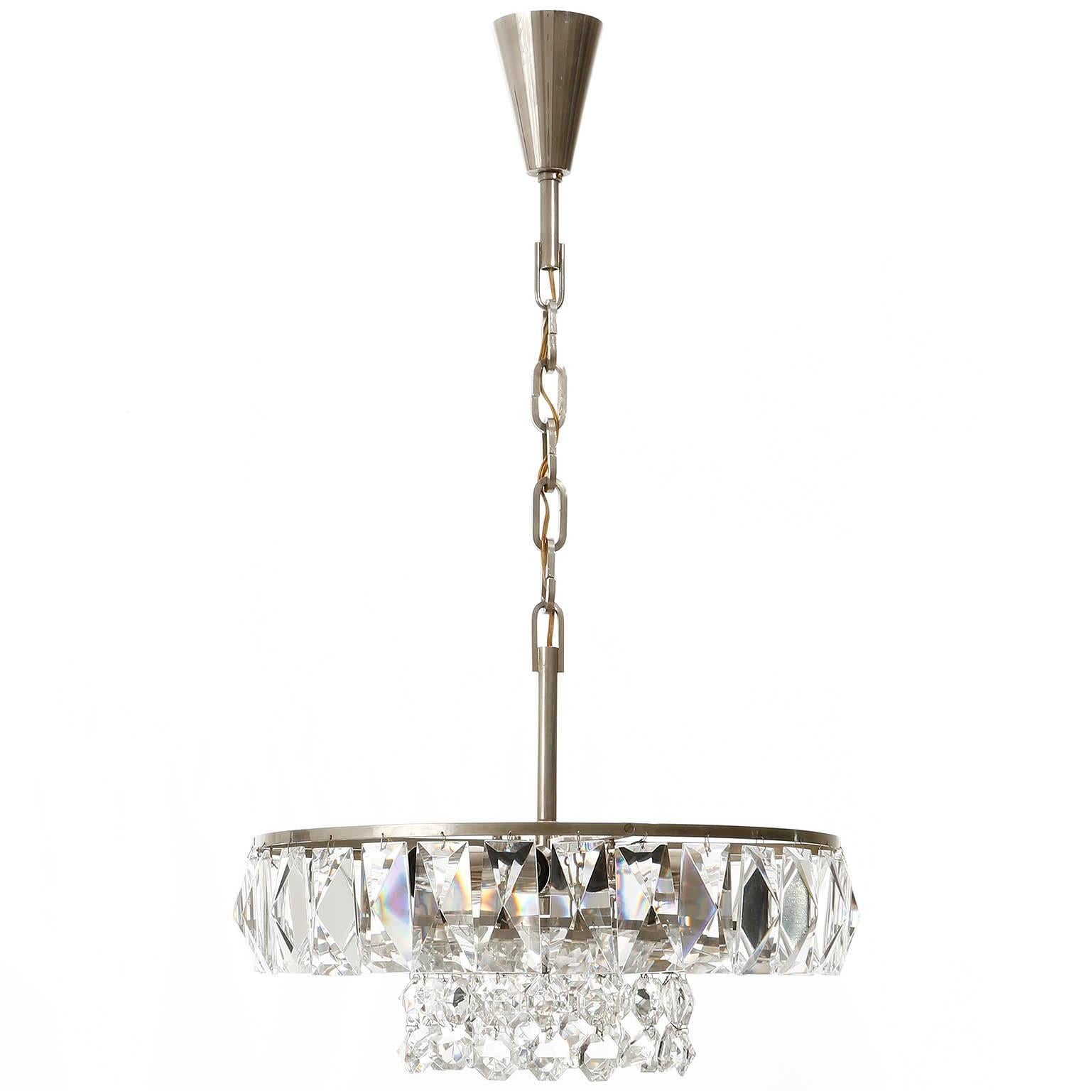 Very beautiful and high quality Austrian chandelier by Bakalowits & Söhne from the 1960s. It is made of hand cut diamond shaped crystals, large rhomb shaped crystals and a nickel (chrome) plated frame. 

The large rhomb crystals have a