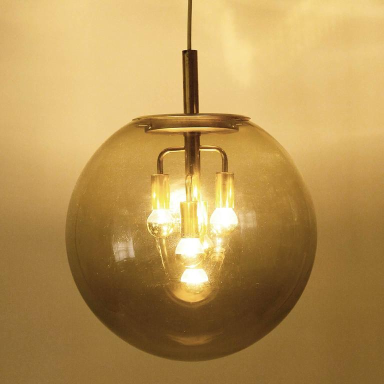 large limburg pendant light brass and amber glass globe large limburg pendant light brass and amber glass globe