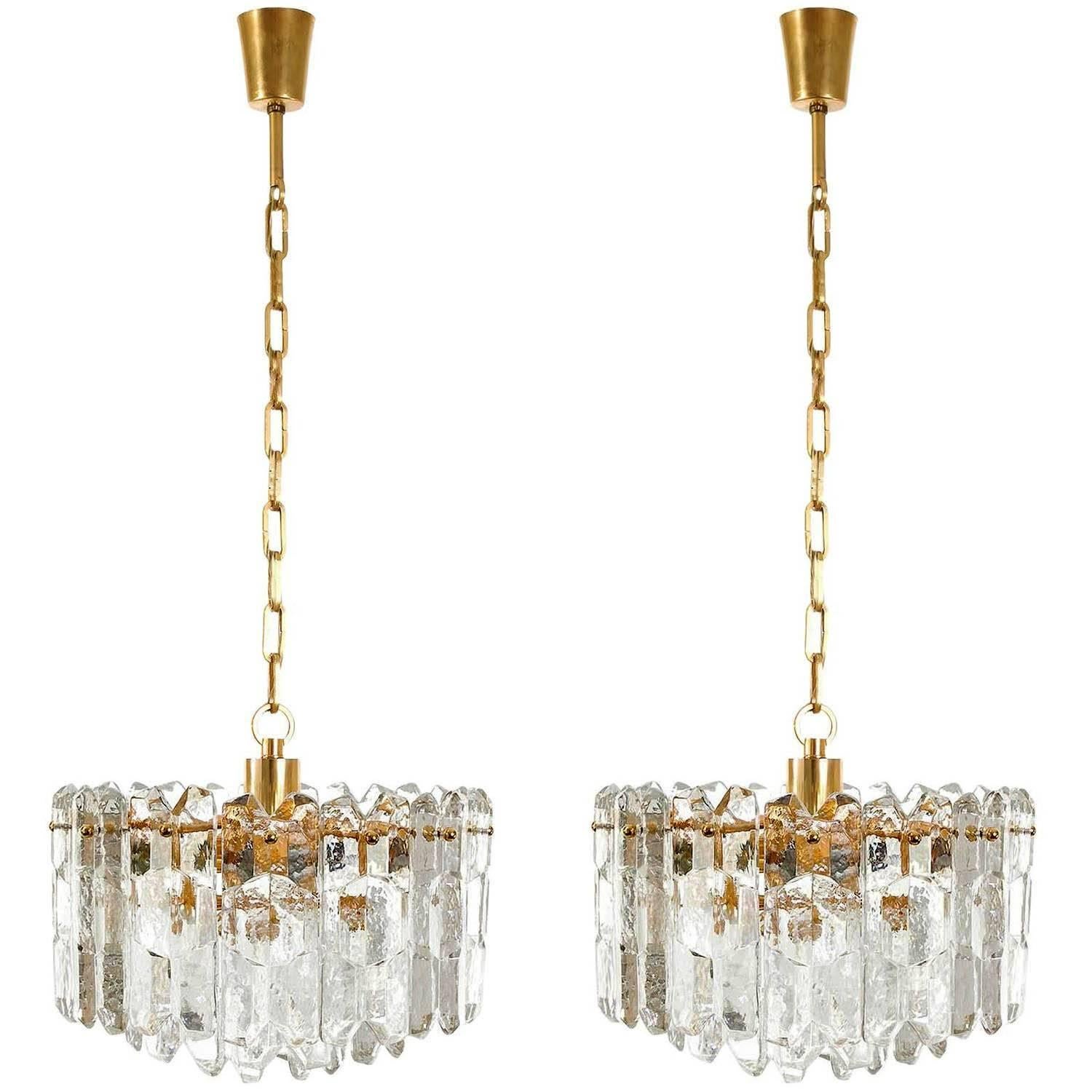 One of three very exquisit 24-carat gold-plated brass and clear brillant glass hollywood regency light fixtures model 'Palazzo' by J.T. Kalmar, Vienna, Austria, manufactured in midcentury, circa 1970 (late 1960s or early 1970s). The lamps are marked