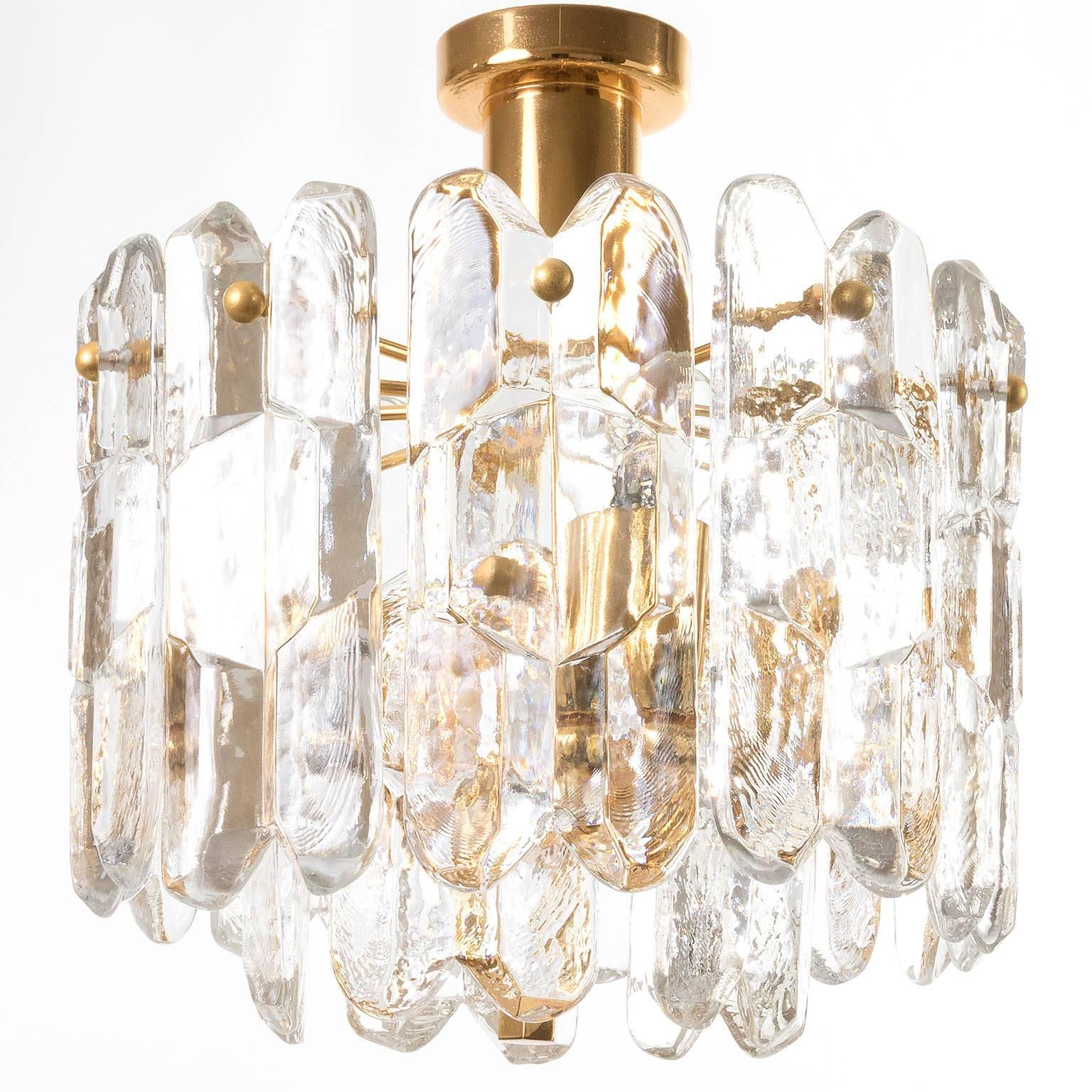 An exquisite 24-carat gold-plated brass and clear brilliant glass 'Palazzo' flush mount lights by J.T. Kalmar, Vienna, Austria, manufactured in circa 1970 (late 1960s and early 1970s). Labeled.
This light is a handmade and high quality piece. Large