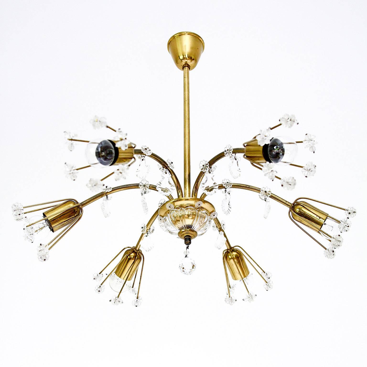 A beautiful pair of floral chandeliers or flush mount light fixtures designed by Emil Stejnar for Rupert Nikoll, Vienna Austria, from the 1950s. We can shorten the stems and add a flush mounting plate if required.

They are made of brass with many