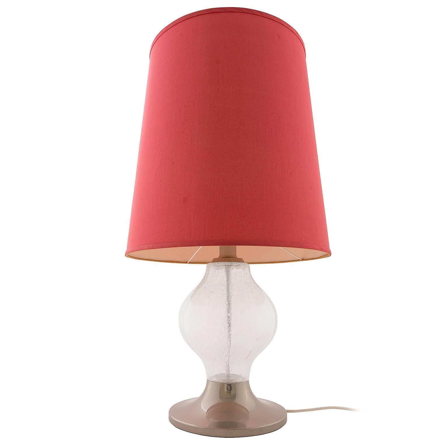 A rare and large 'Tulipan' table or floor lamp by Kalmar, Austria, manufactured in Mid-Century, circa 1970 (late 1960s or early 1970s). 
A nickel-plated base with a large handblown bubble glass. The red lamp shade is in original and very good