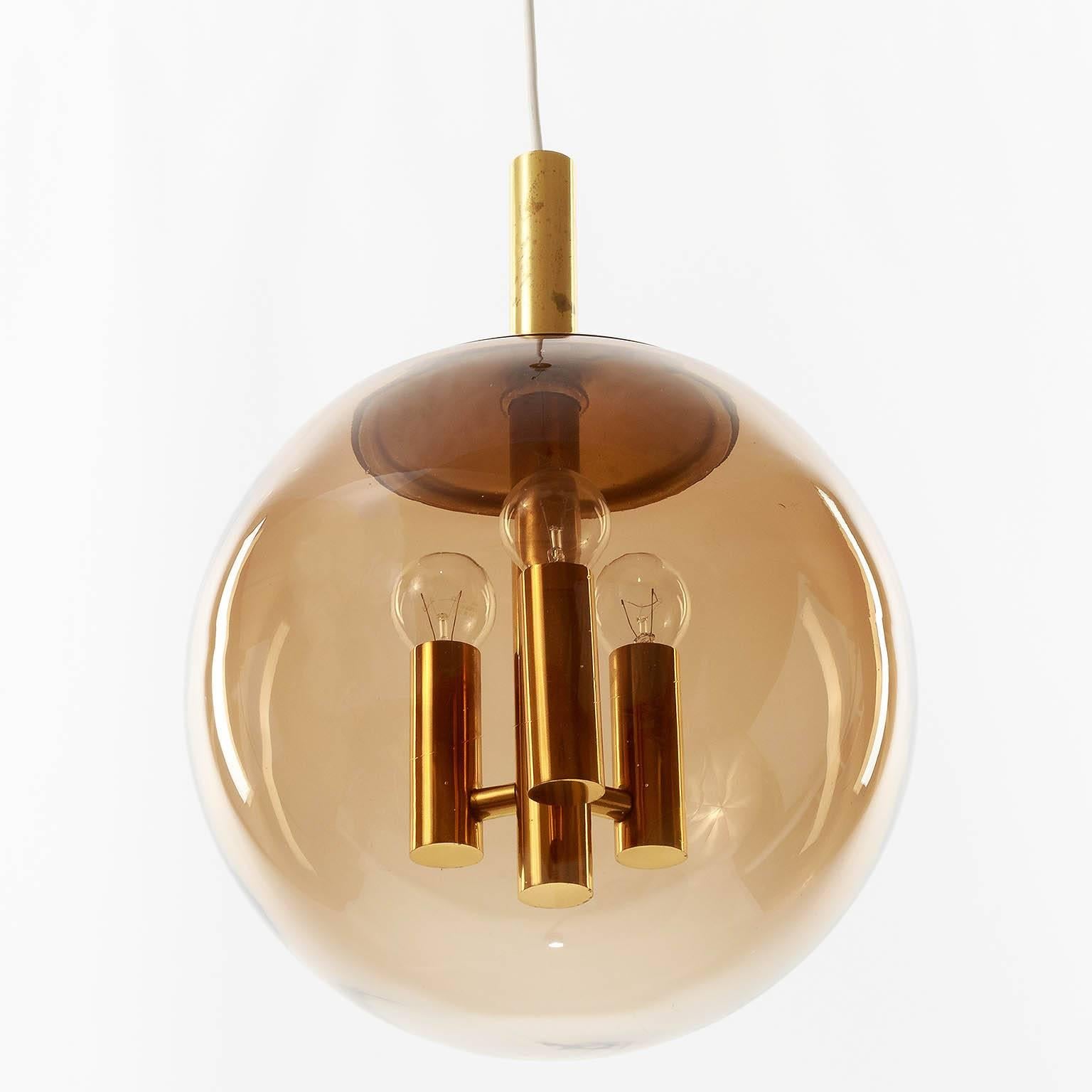Mid-Century Modern Limburg Pendant Light Brass and Amber Tone Glass Globe, 1960s For Sale
