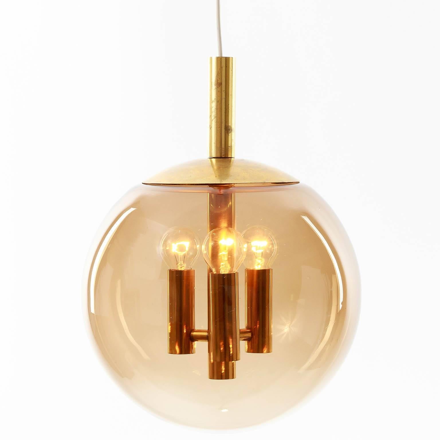Limburg Pendant Light Brass and Amber Tone Glass Globe, 1960s In Good Condition For Sale In Hausmannstätten, AT