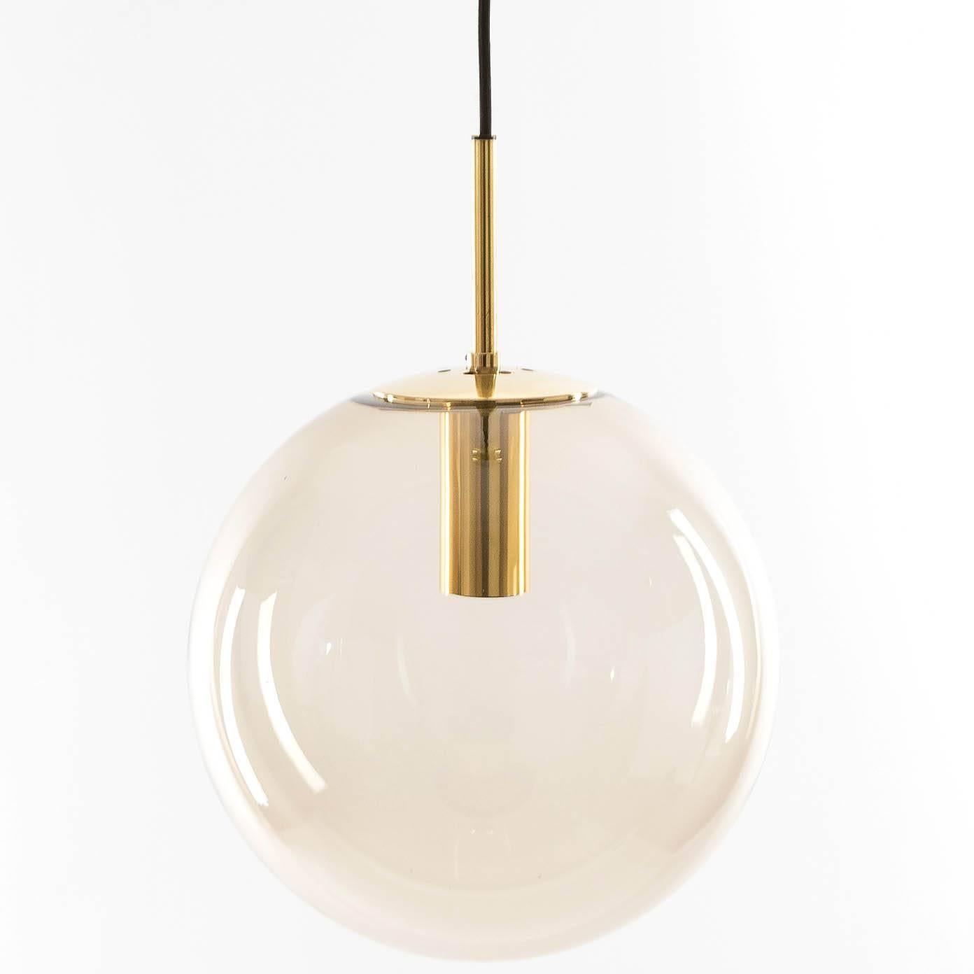 A large handblown glass globe pendant light by Glashütte Limburg, Germany, 1970s. Polished brass hardware. Smoke/amber/topaz/brown amethyst tone glass. Excellent condition, newly rewired. The cord can be customized to any length for free. Low 1