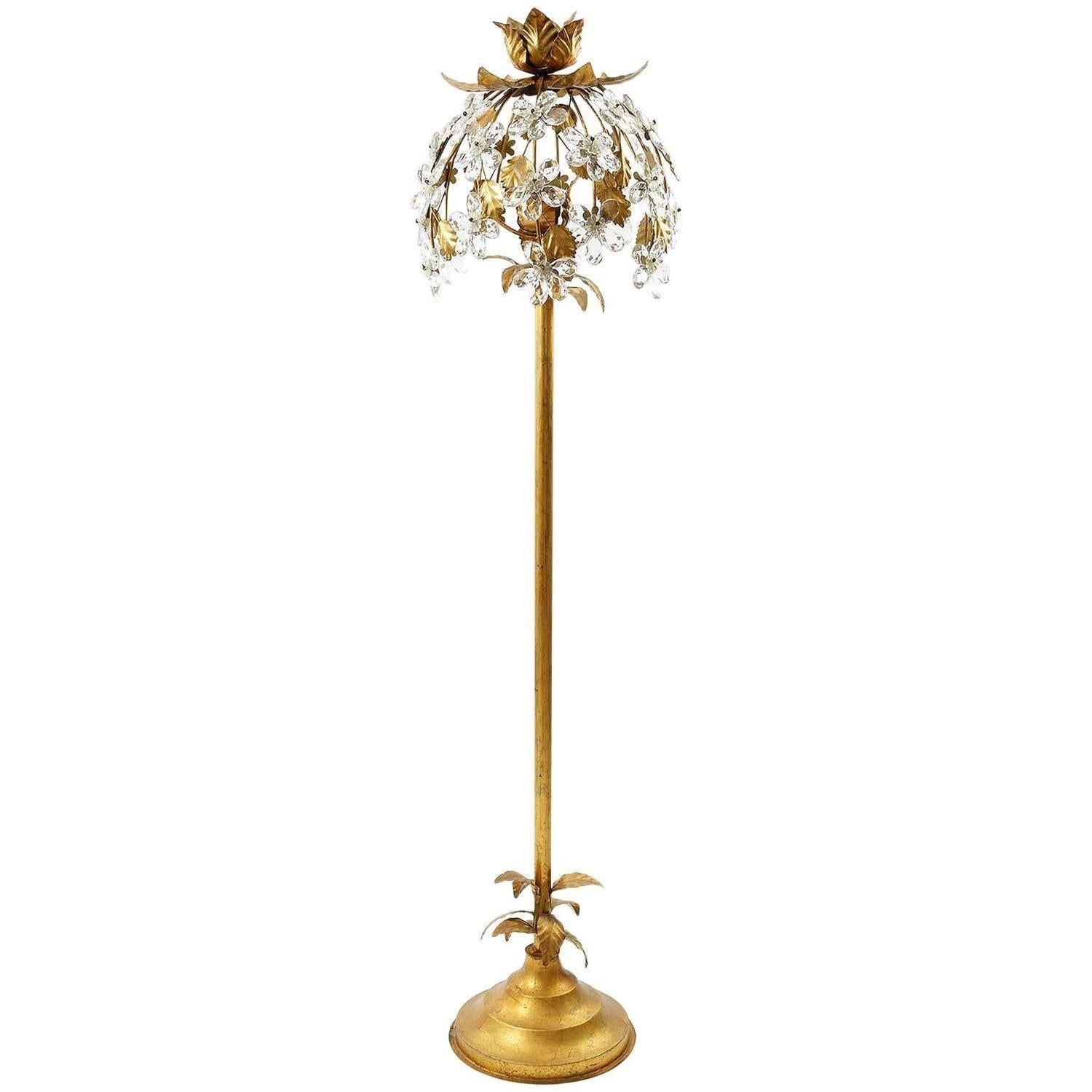 One of two wonderful floral hollywood recengy floor lights, manufactured in Mid-Century in Italy between 1960 and 1970. They are made of crystal glass and metal in an antique gilt or bronzed finish. Each light takes one standard screw base bulb.