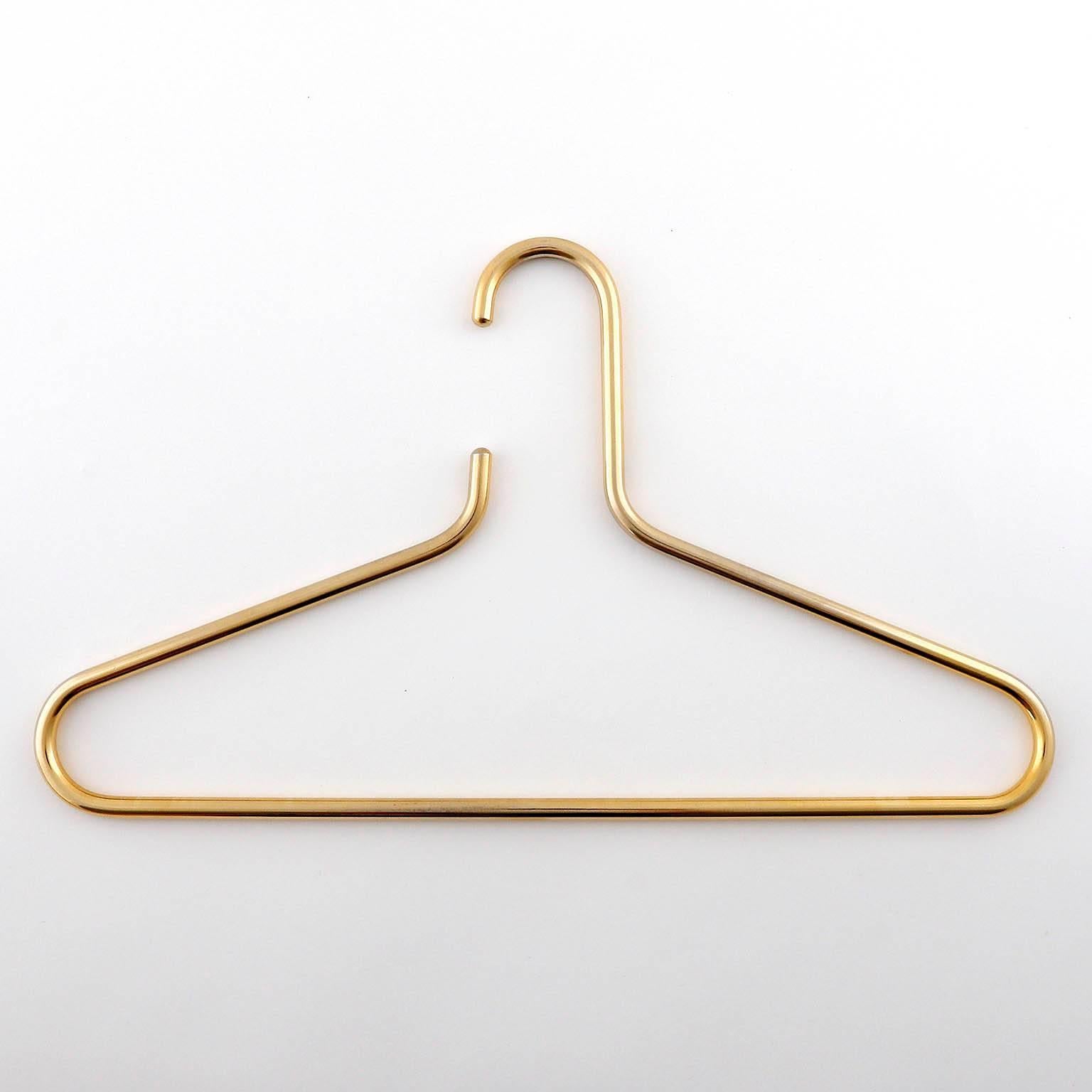 A set of ten coat hangers manufactured in Mid-Century (1960s-1970s). A simple and timeless design. Very solid craftsmanship.

The price is per hanger. The hangers will be sold singly, as pair or as set of three, four, five, six, seven, eight, nine