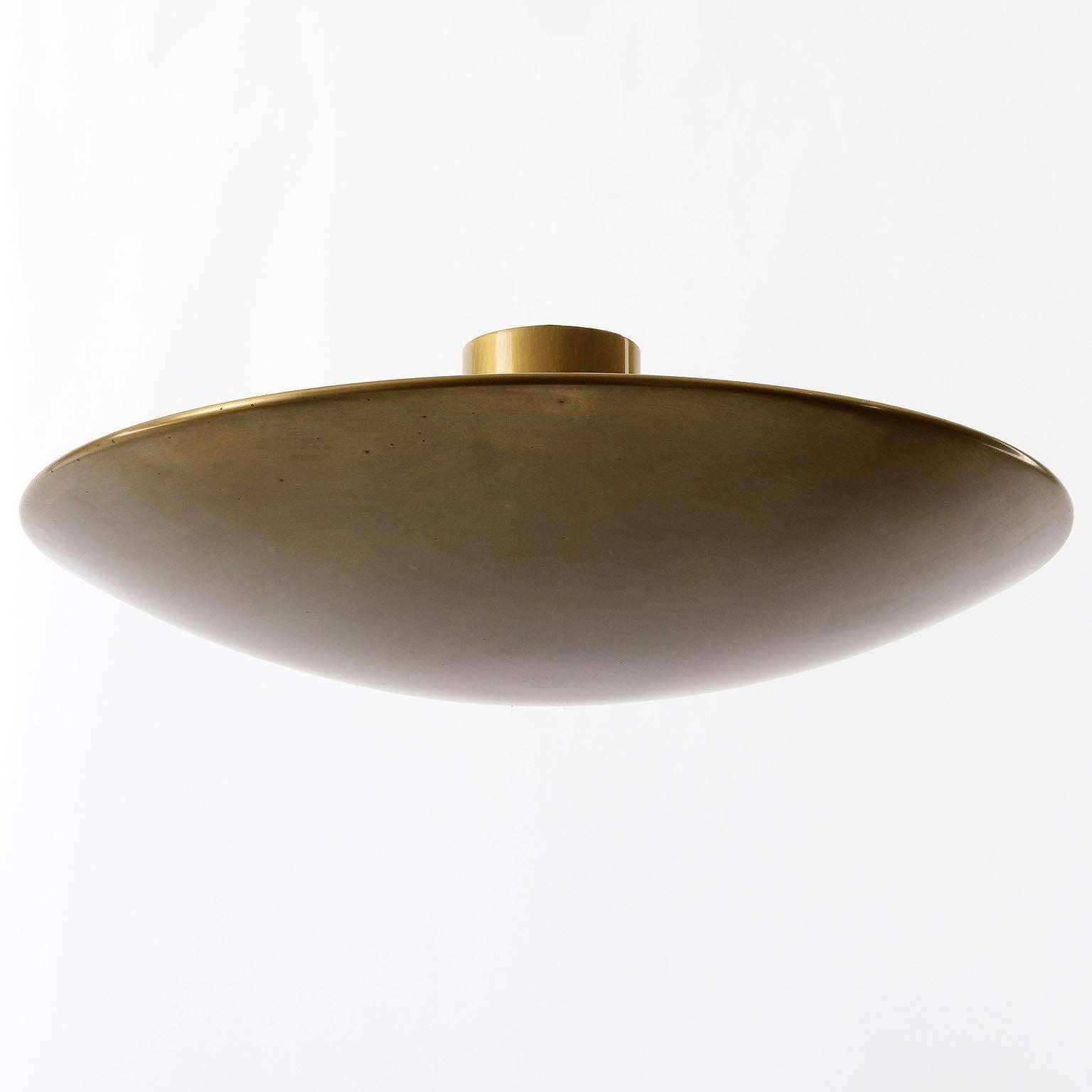 An uplight bowl ceiling light fixture by Florian Schulz, Germany, manufactured in Mid-Century, circa 1970 (late 1960s - 1970s). The lamp is made of patinated solid brass in a tarnished finish. It takes five small Edison base bulbs.

The same but