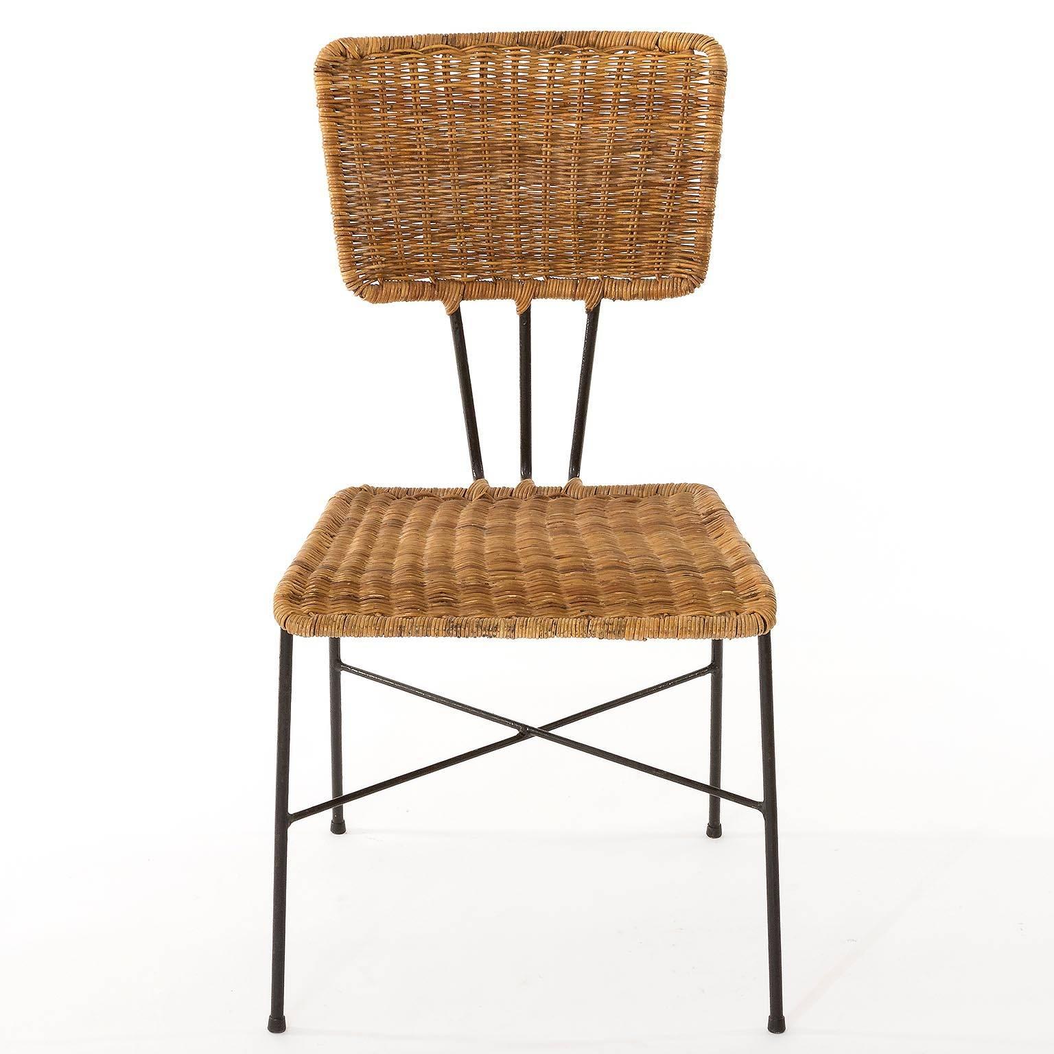 A set of six wicker and blackened iron chairs, manufactured in Mid-Century in 1950s. Original and good vintage condition with little wear.

The price is per chair. They will be sold singly, as pair or as set of three, four, five or six chairs.