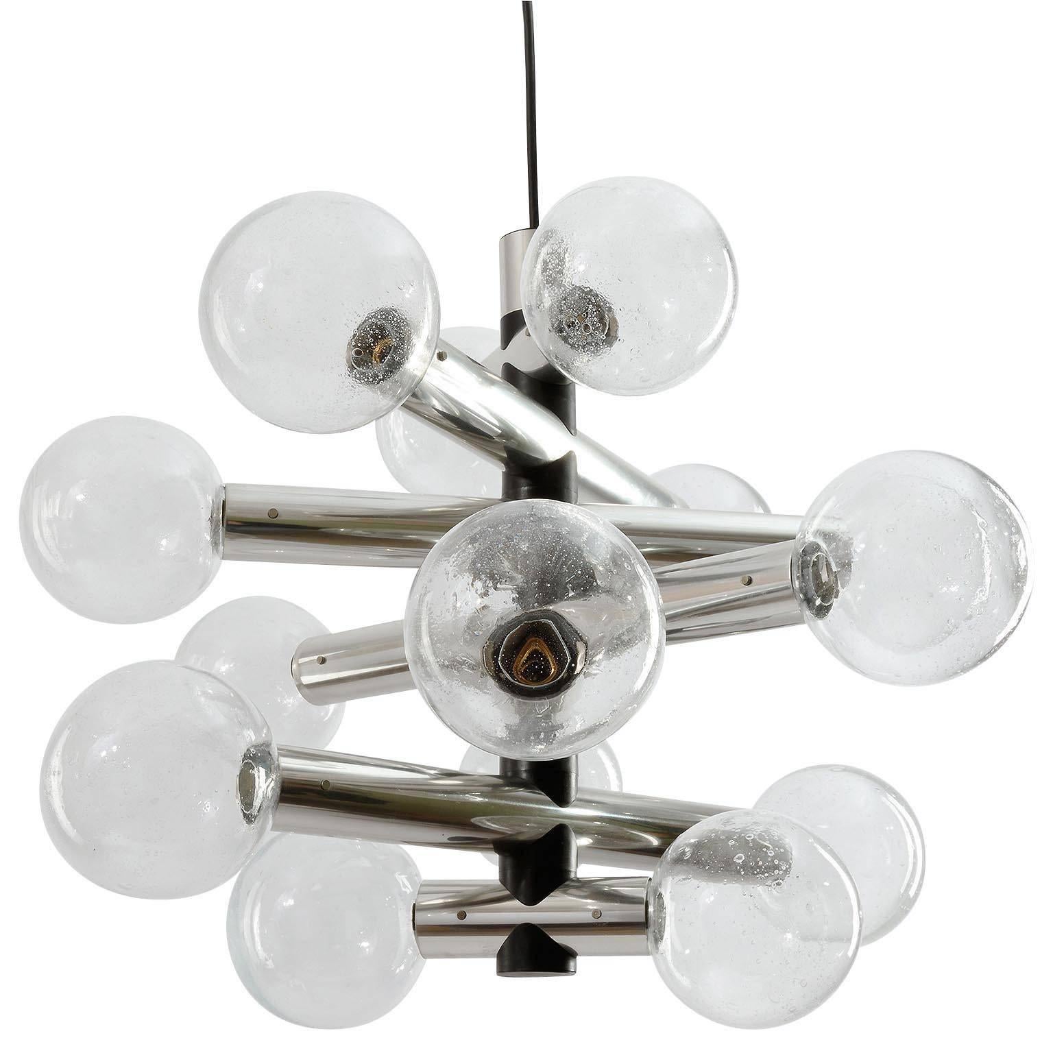 A fantastic and rare 14-arm chandelier / pendant light by Kalmar, Austria, manufactured in Mid-Century, circa 1970 (late 1960s - early 1970s). 
It is made of polished aluminum and handblown bubble glass lamp shades with a diameter of 4.7 inch (12