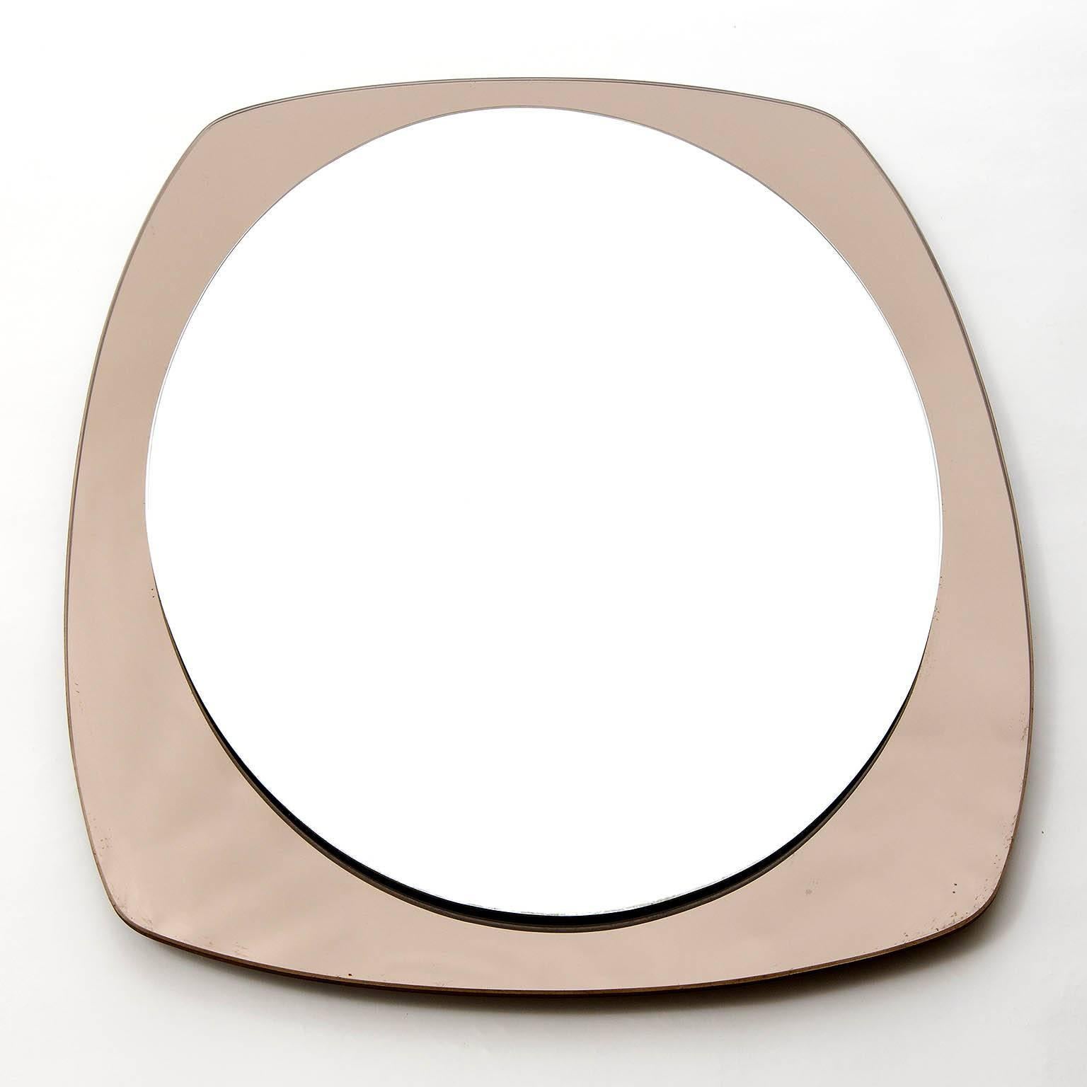 A large Italian wall mirror manufactured in Mid-Century, circa 1970 (late 1960s or early 1970s). It is made of a clear front mirror and a smoked brown mirrored backplate glass.
In the style of Fontana Arte.