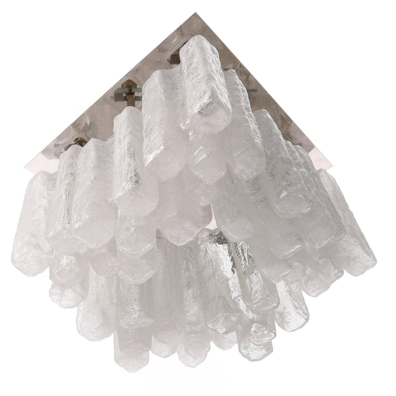 One of nine square light fixtures by Kalmar, Austria, manufactured in Mid-Century, circa 1970 (late 1960s or early 1970s). 
Each fixture has eight sockets for small screw base bulbs E14 (e.g. LED or filament, max. 40 W per bulb) which are covered