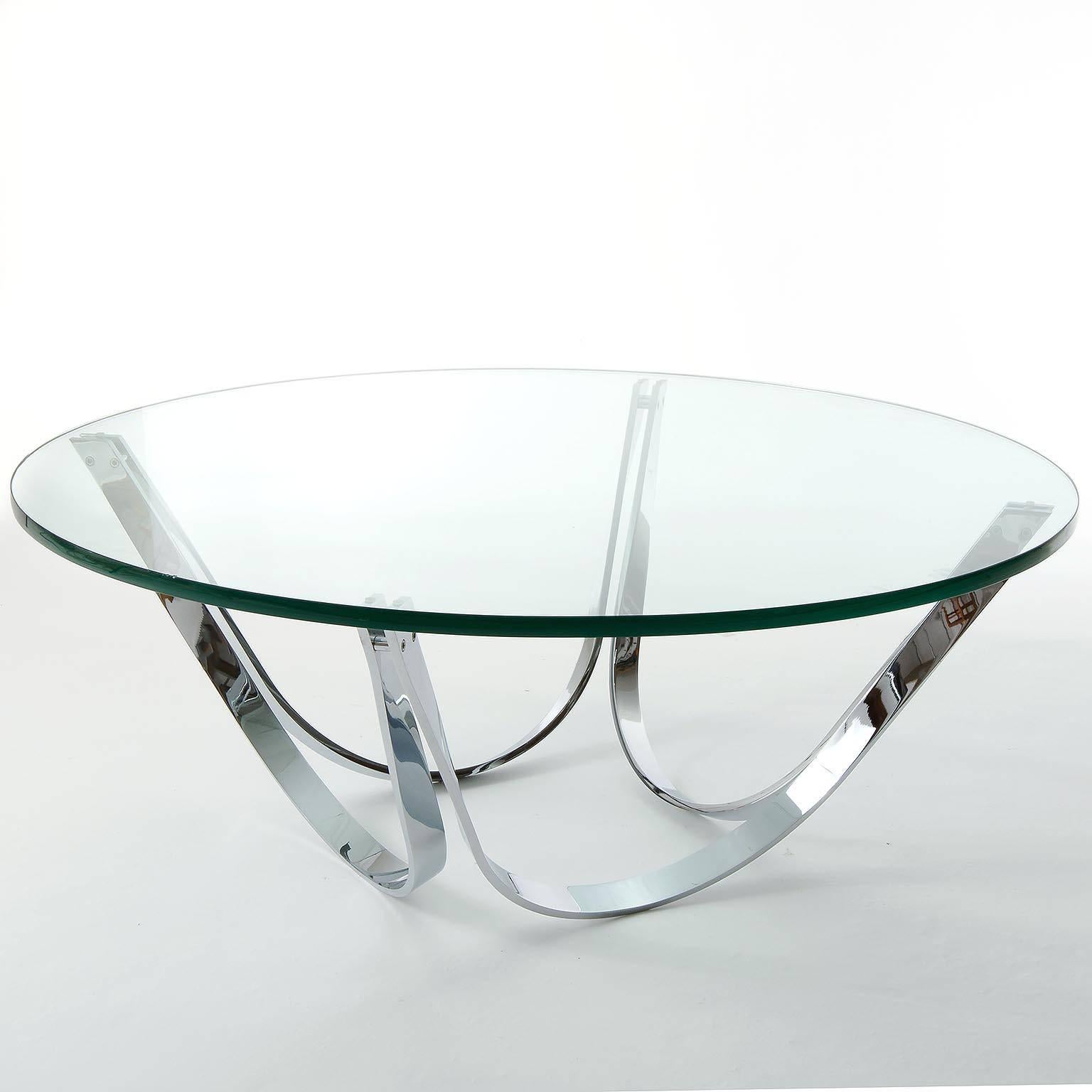 Two Roger Sprunger cocktail tables for Tri-Mark, manufactured in Mid-Century in 1970s.
A round glass top on a polished chrome base. The base can be flipped over to be used either way. 
The price is per table. They will be sold individually or as