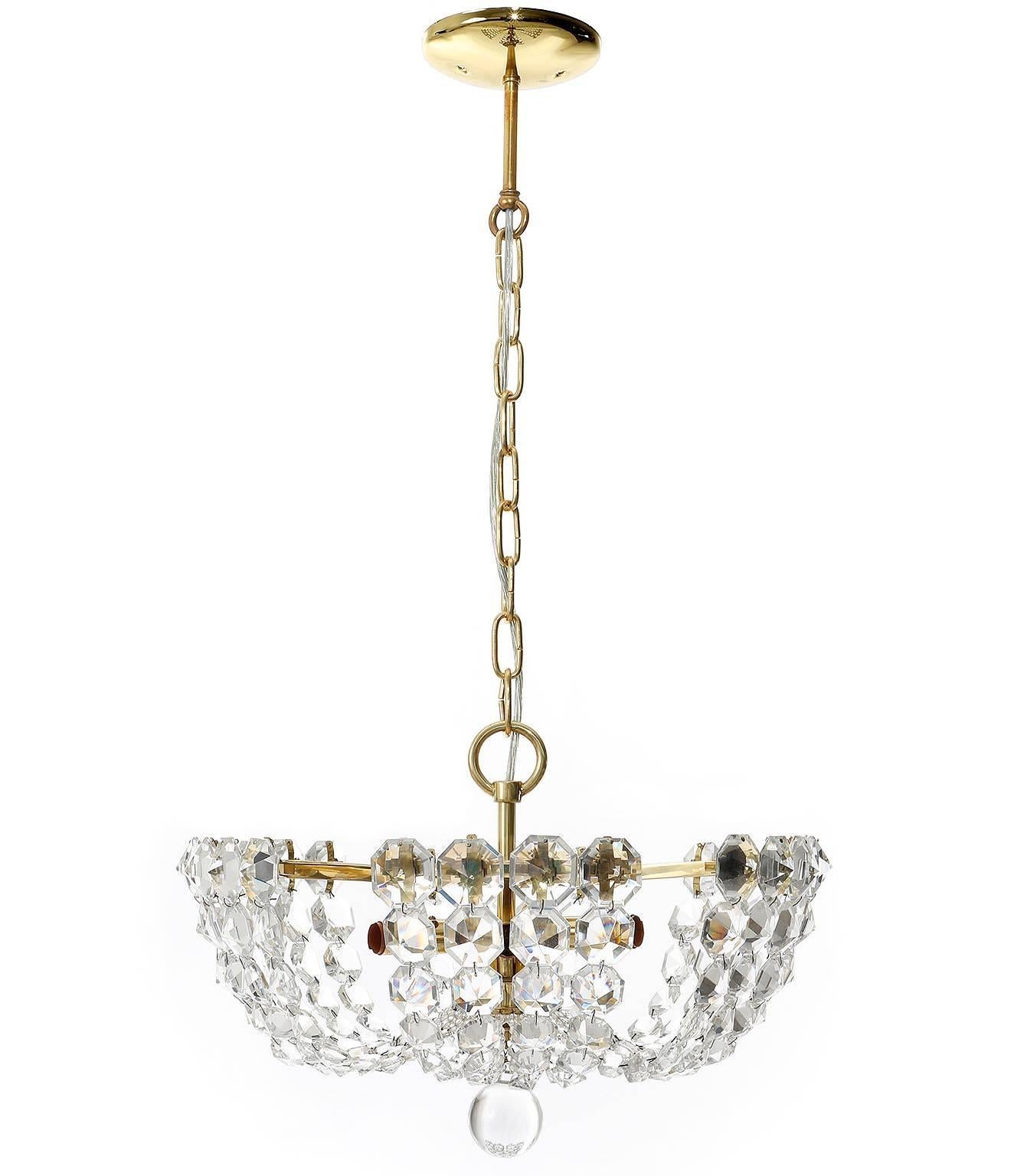 A beautiful and unusual basket light fixture by J.L. Lobmeyr, Vienna, Austria, manufactured in Mid-Century, circa 1960 (end of 1950s and beginning of 1960s).
It is made of brass and hand cut diamond shaped crystal glass. Outstanding workmanship, a