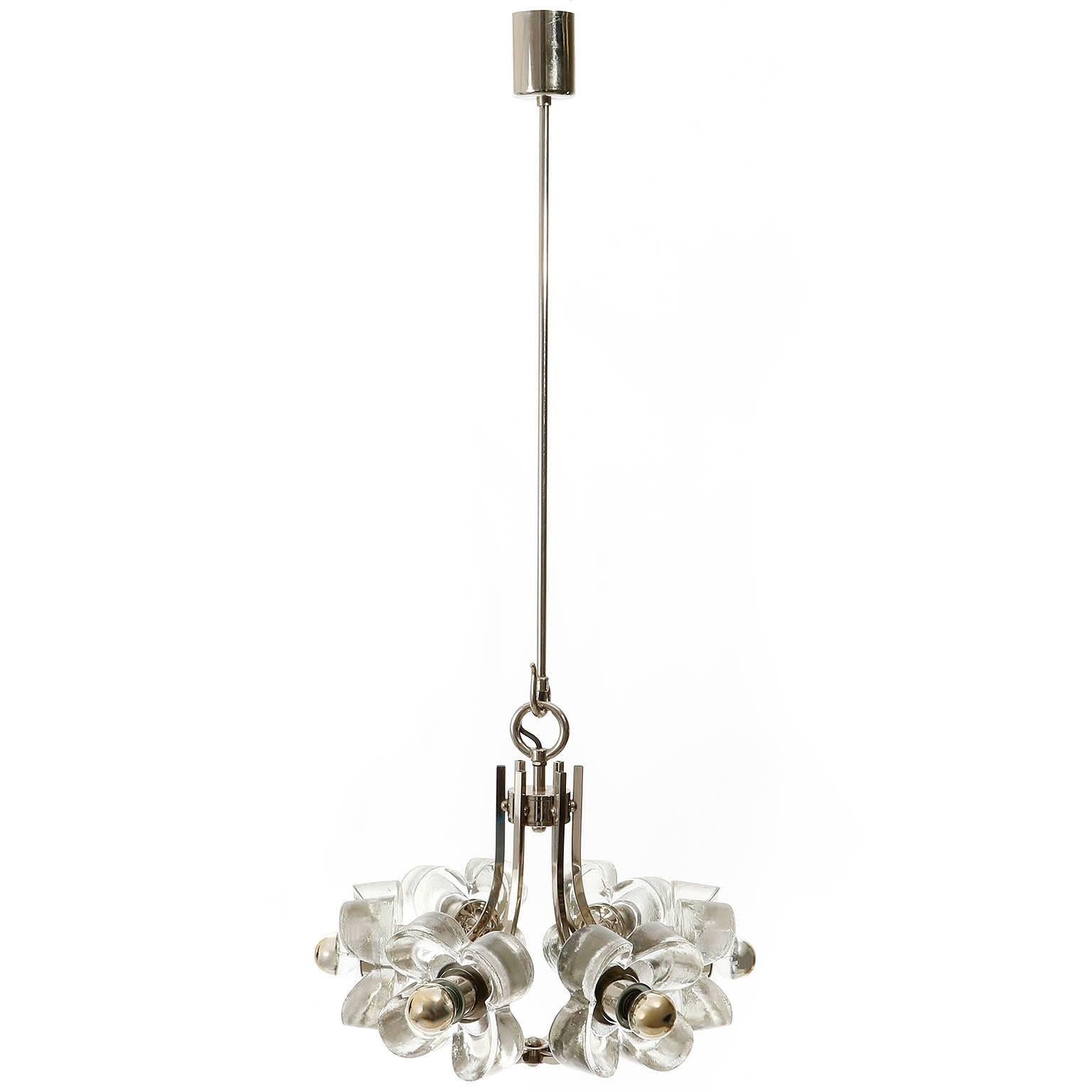 A pair of beautiful floral chandeliers / pendant lamps made of ice glasses and chrome-plated brass, manufactured in Mid-Century, circa 1970s. 
Each chandelier takes six small screw base bulbs. Excellent condition. 

The price is per light. They will
