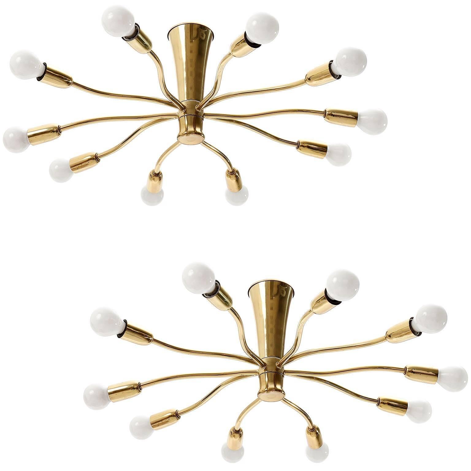 One of two 10-arm brass spider flush mount light fixtures by Kalmar, manufactured in Mid-Century, circa 1960 (late 1950s or early 1960s).
The price is per fixture. They will be sold individually or as pair.
The lamps are in excellent refurbished