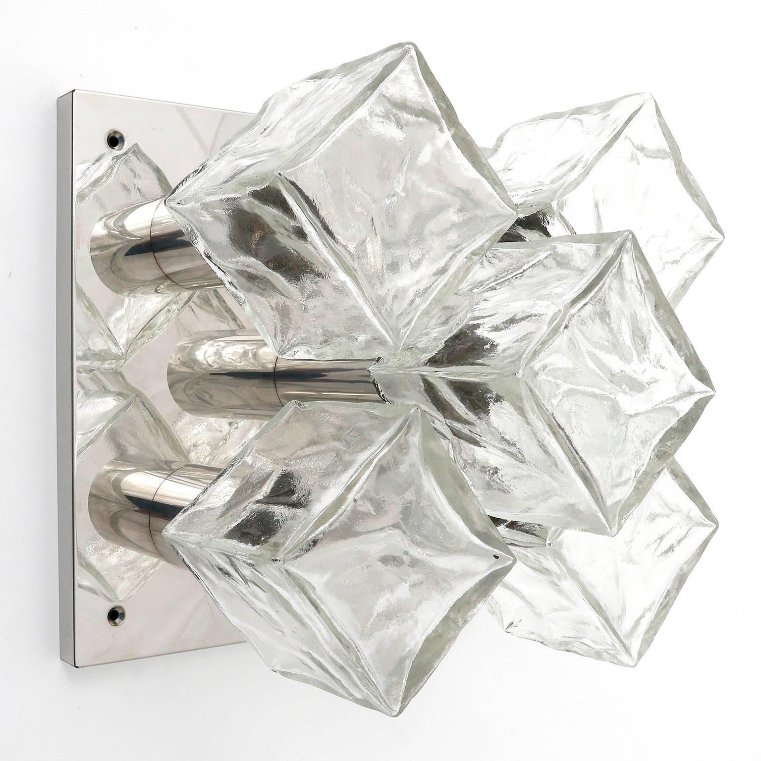 One of four modulare and square light fixtures model 'Cubus' (German 'Würfel') by Kalmar, Austria, manufactured in Mid-Century, circa 1970 (late 1960s or early 1970s).
They are made of polished chrome and frosted cubic glasses. Each fixture has five