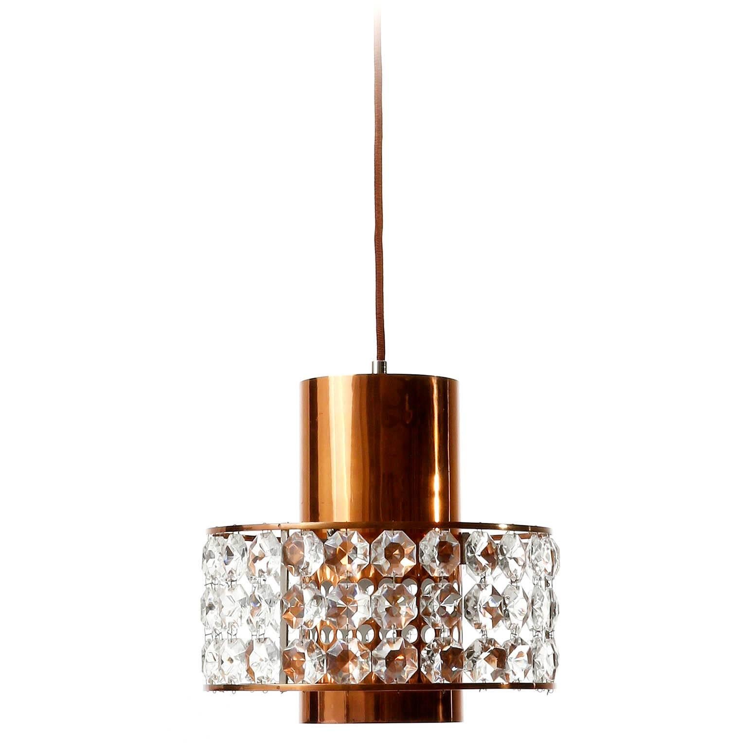 One of three fantastic lanterns or pendant lamps by Bakalowits und Söhne, Austria, Vienna, manufactured in Mid-Century, circa 1960.
They are made of a nickel-plated brass and copper frame which is decorated with diamond cut crystal glass. There is
