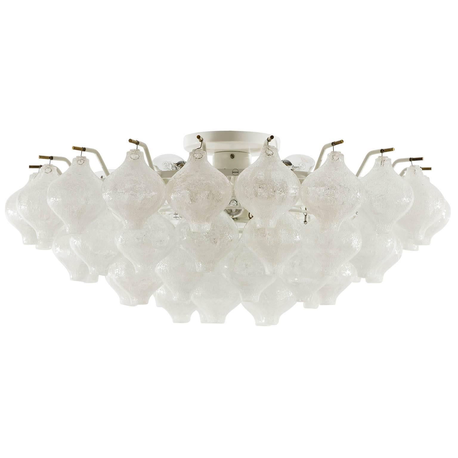 A large and fantastic "Tulipan" flush mount chandelier by J.T. Kalmar, Austria, Vienna, manufactured in midcentury (late 1960s or early 1970s).
The name Tulipan derives from the tulip shaped handblown bubble glasses. 51 glasses are mounted