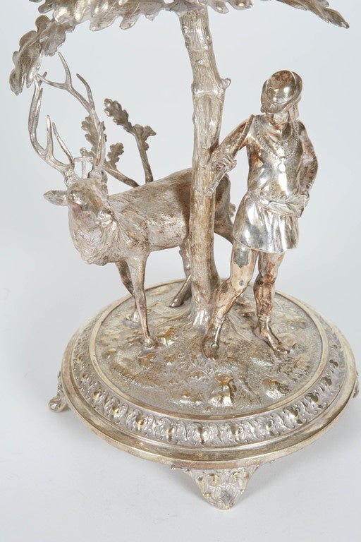 Silver base with deer and hunter and glass bowl with frosted detailing.