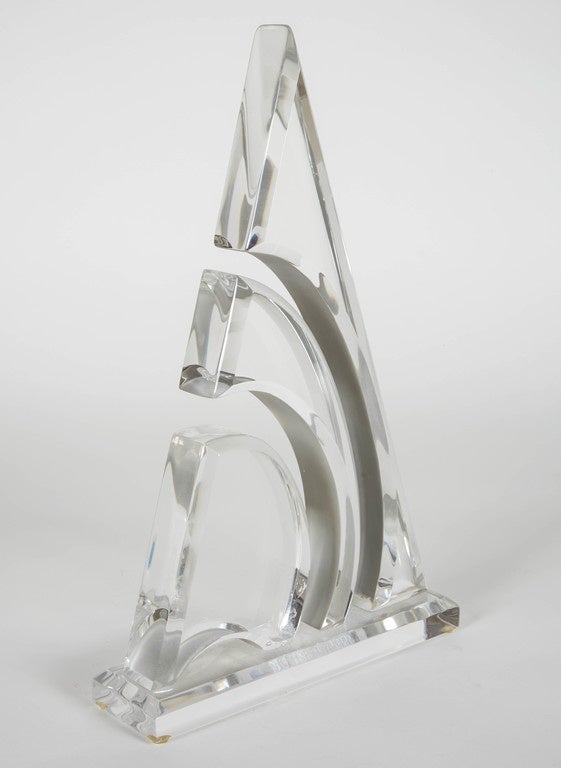 Tall vintage Lucite sailboat sculpture with cutouts.