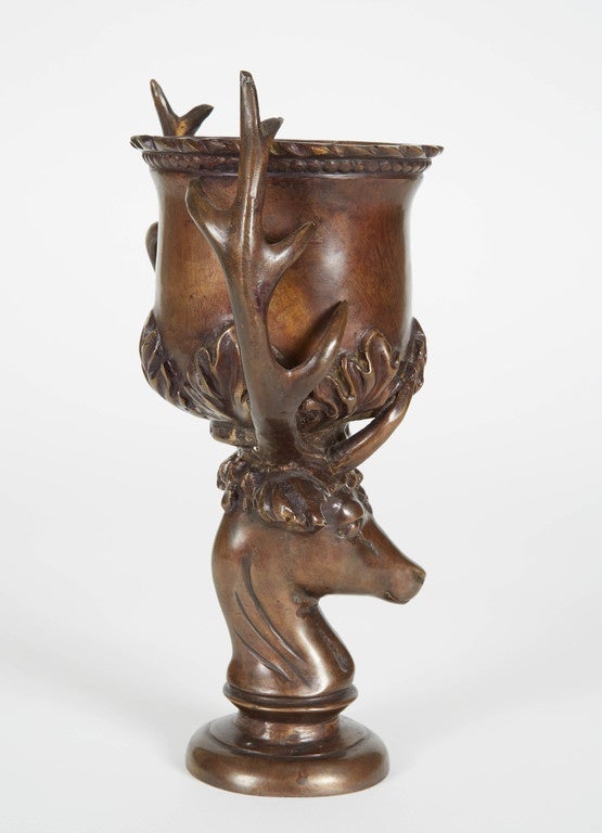 Bronze antique German chalice from the 1890s. This unique chalice has a deer head base and antlers. The sculptural details make this item a beautiful additional to any den or lodge.