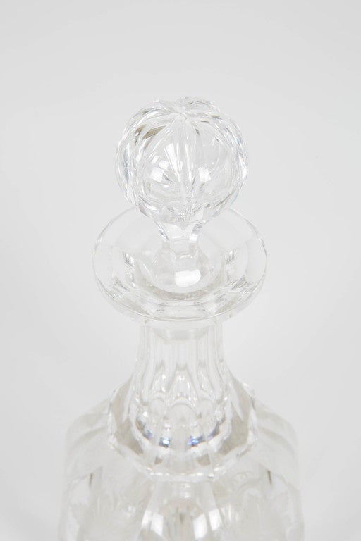 Clear vintage English decanter from the early 20th century. The all-over carved detailing makes this piece an elegant addition to any bar or table setting.