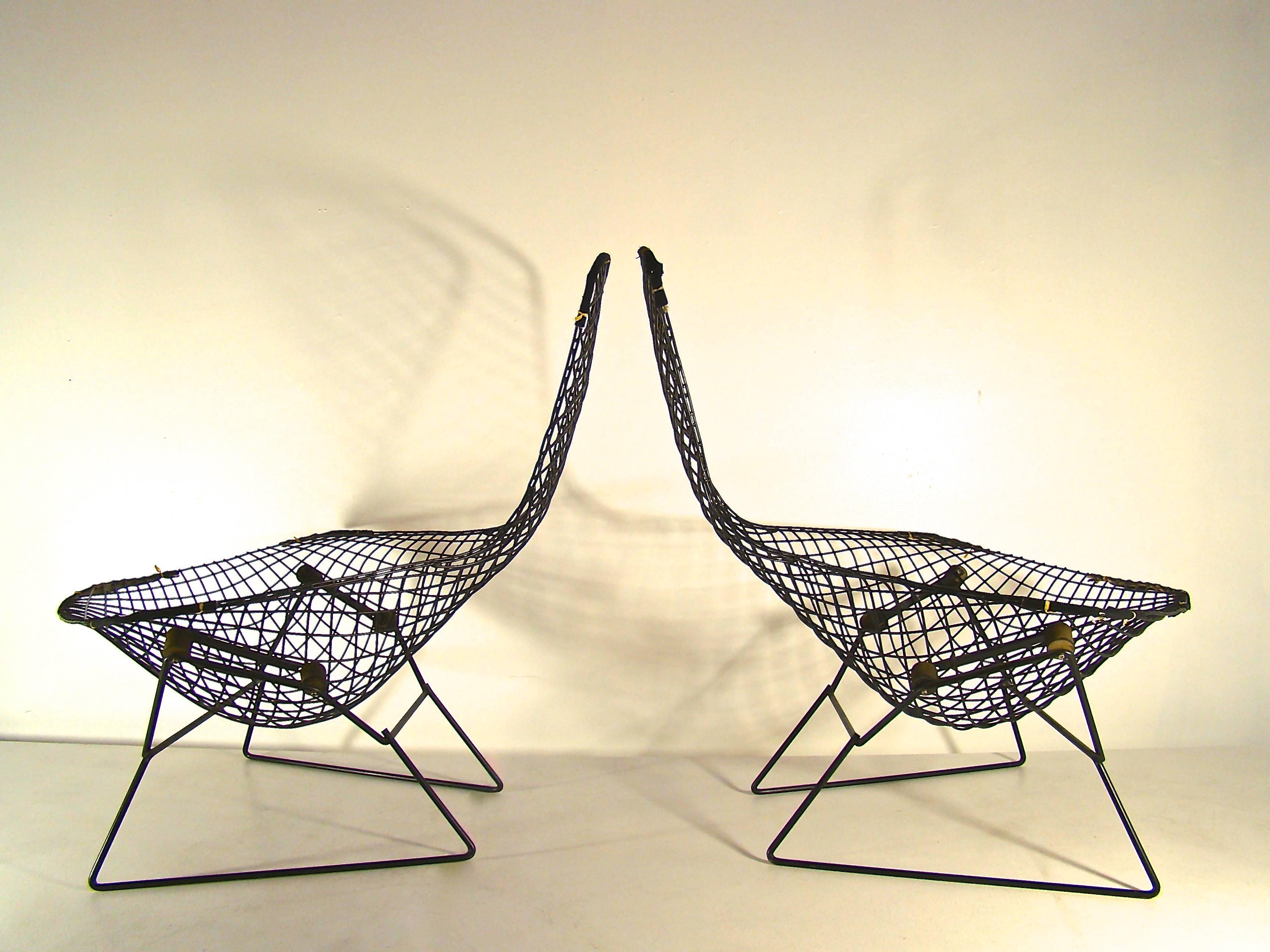 Beautiful and iconic chairs by Harry Bertoia in black finish welded steel. The chair is not only beautiful but extremely comfortable. Both of these chairs have been cared for extremely well and are in all excellent original condition. They are solid