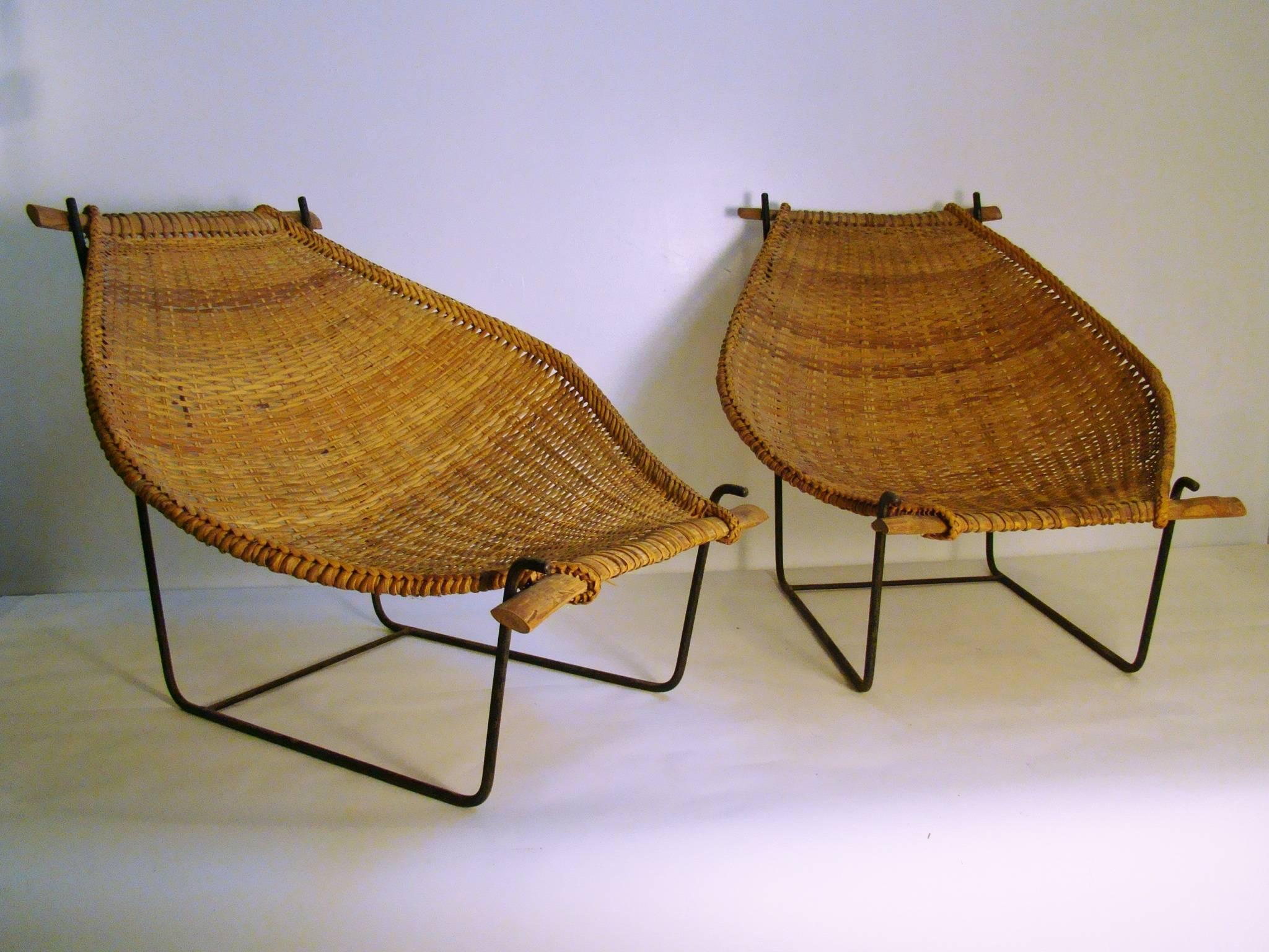Beautiful Rattan and Wrought Iron bamboo sling lounge chair on a sled base, circa 1960s. So comfortable, before you know it, you'll be California dreaming'! The bamboo sling sits on the frame and is easily removable for storage in colder climates.