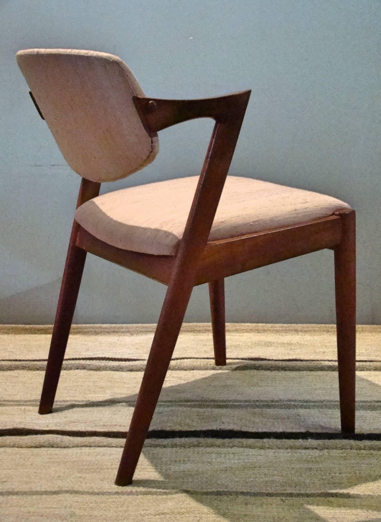 Beautiful set of eight teak dining chairs by Kai Kristiansen, circa 1960s. From any angle, these chairs are stunning and equally comfortable.